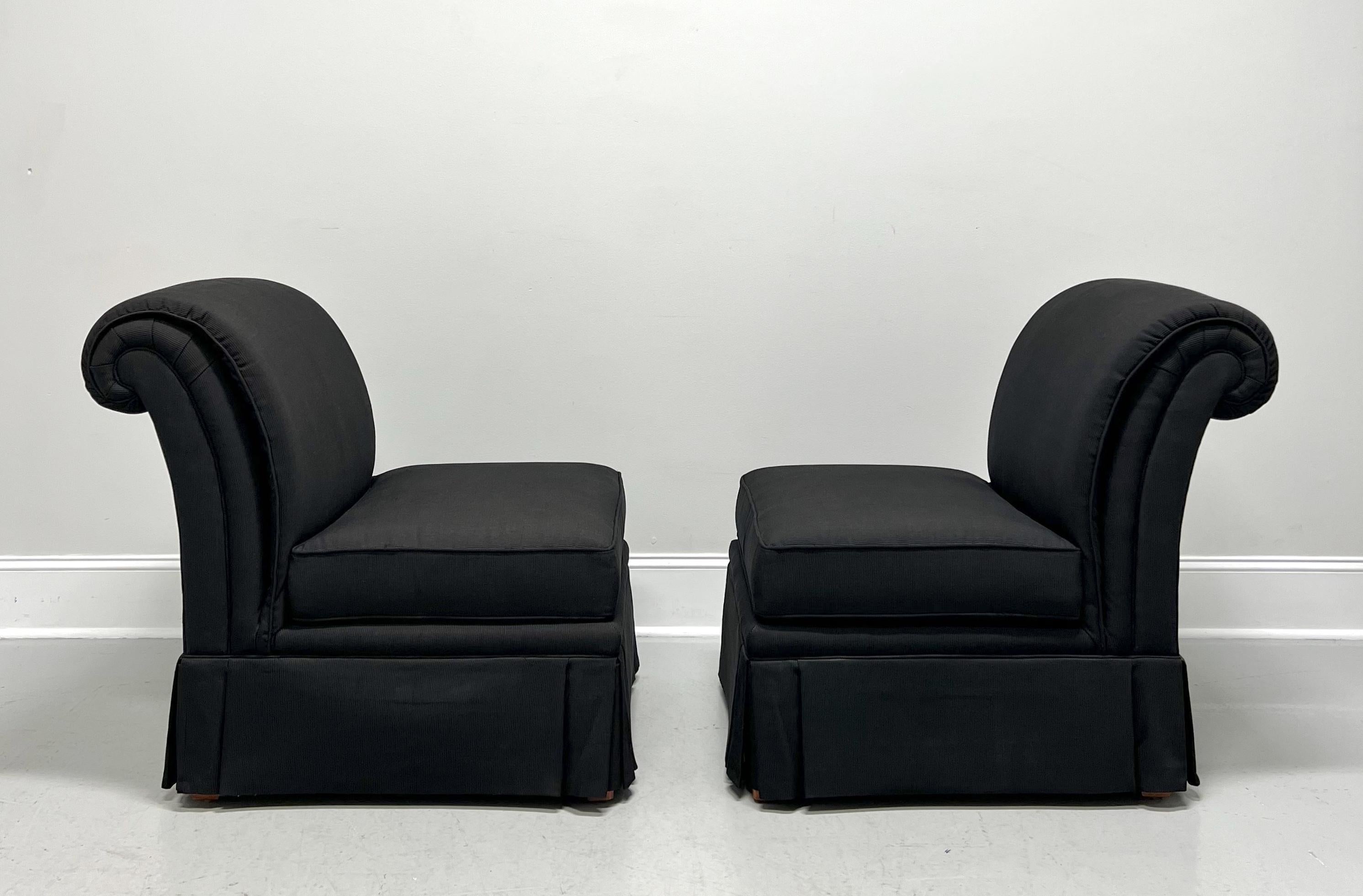 A pair of Contemporary style slipper chairs by Henredon. Solid wood frame, slipper armless design with a roll back, black color narrow wale corduroy fabric upholstery, reversible seat cushion, and fully skirted.  Made in North Carolina, USA, circa