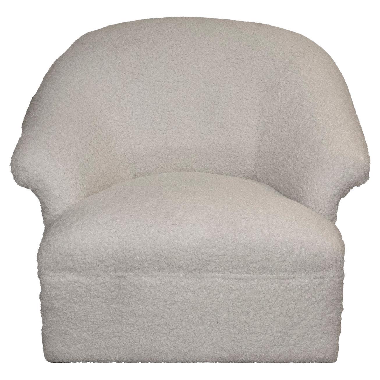 The generously sized curved swivel club chair, originally made by Henredon. Freshly upholstered in a white faux shearling fabric. The new faux shearling upholstery lends a contemporary feel. The swivel base makes this chair useable in many spaces.