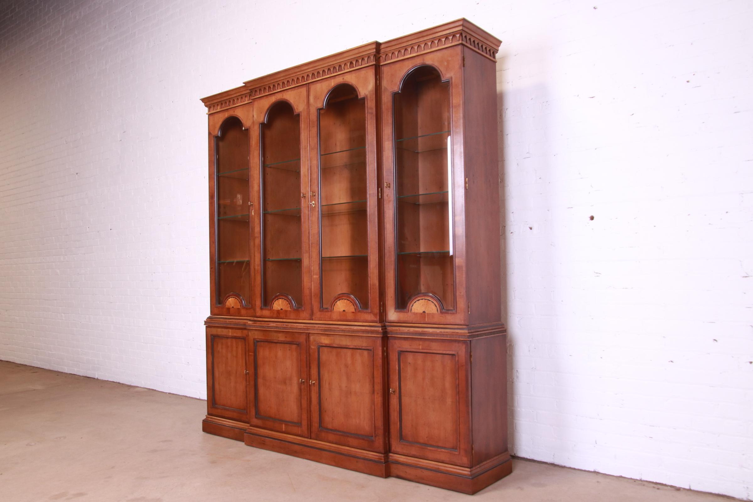 A gorgeous English Georgian style lighted breakfront bookcase or display cabinet.

By Henredon, 