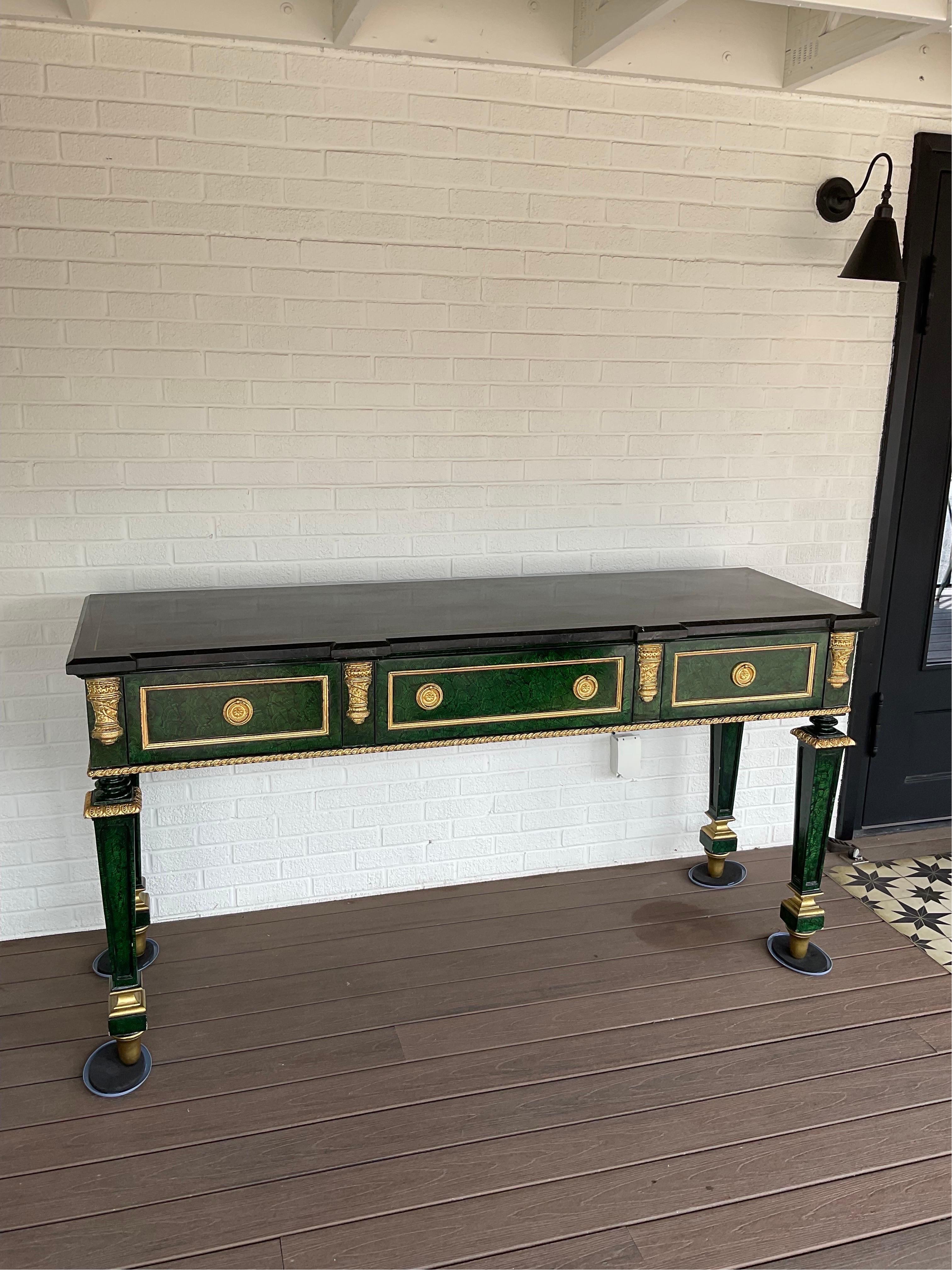 Magnificent Henredon Faux Malachite console table with tessellated Marble Top from their “Grand Provenance” Collection. It’s massive and likes to be the center of attention. Beautiful vintage condition. Hand painted faux Malachite finish is