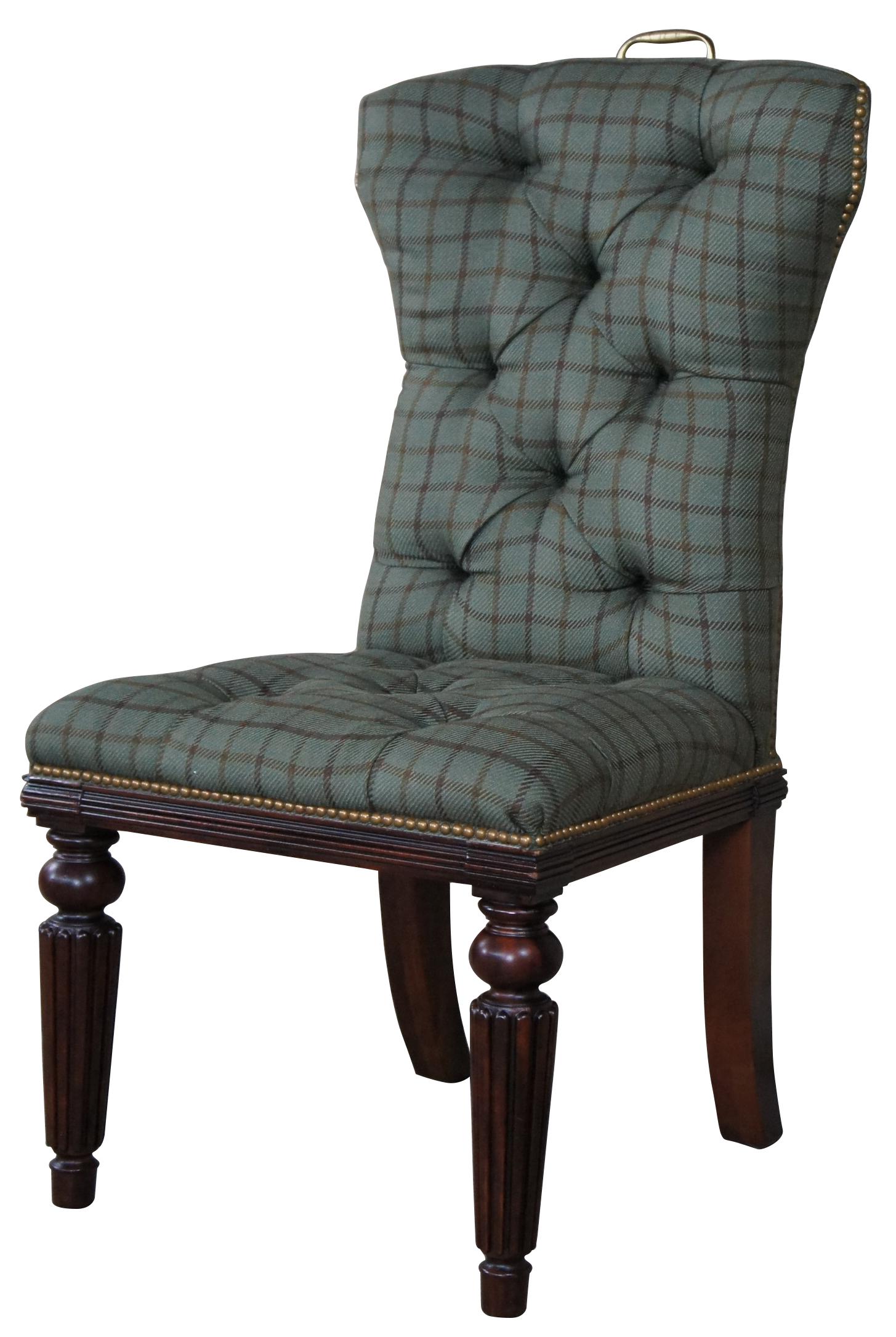 Traditional Ralph Lauren chair. Features shaped tall backs, tufted green plaid wool upholstery with nail head trim and brass handle along the back. Supported by turned mahogany reeded legs with real splay legs.
 