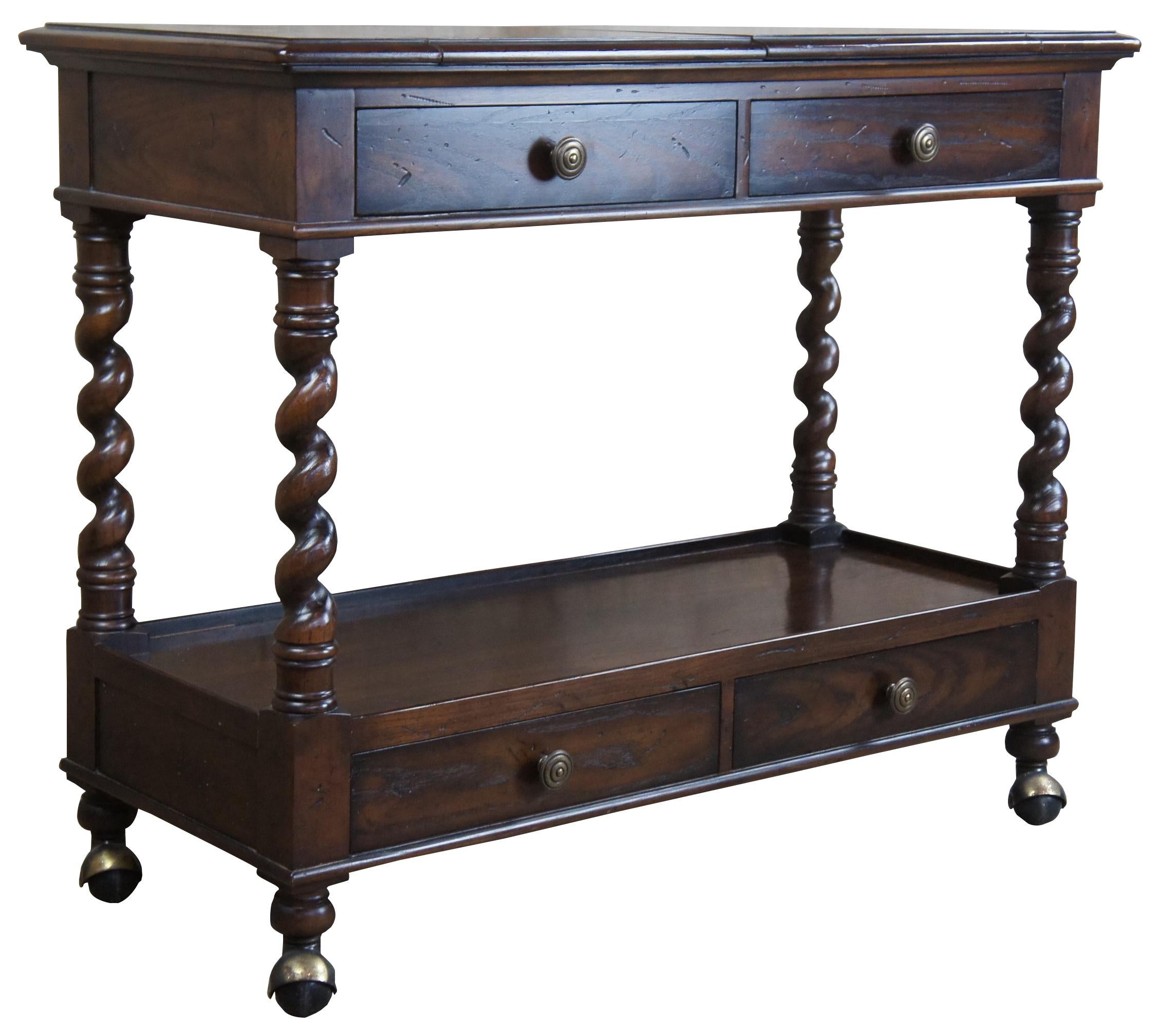 Vintage Henredon four centuries rolling buffet or server. Made of oak, featuring a flip top that opens over four barley twisted supports between two sets of drawers and large castors.

Measure: Width open - 56