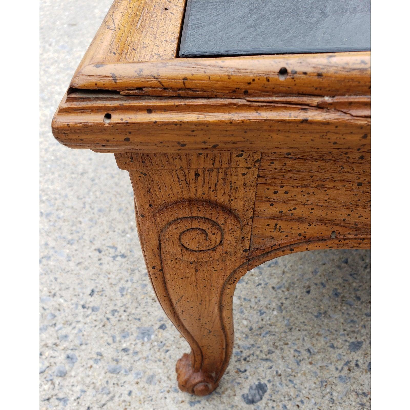 A pair accent tables by Henredon from their Town & Country Collection. French Country style with scroll feet. Solid Oak with a distressed finish. Removable slate tops. Made in the USA in the late 20th Century. Excellent Condition.
 