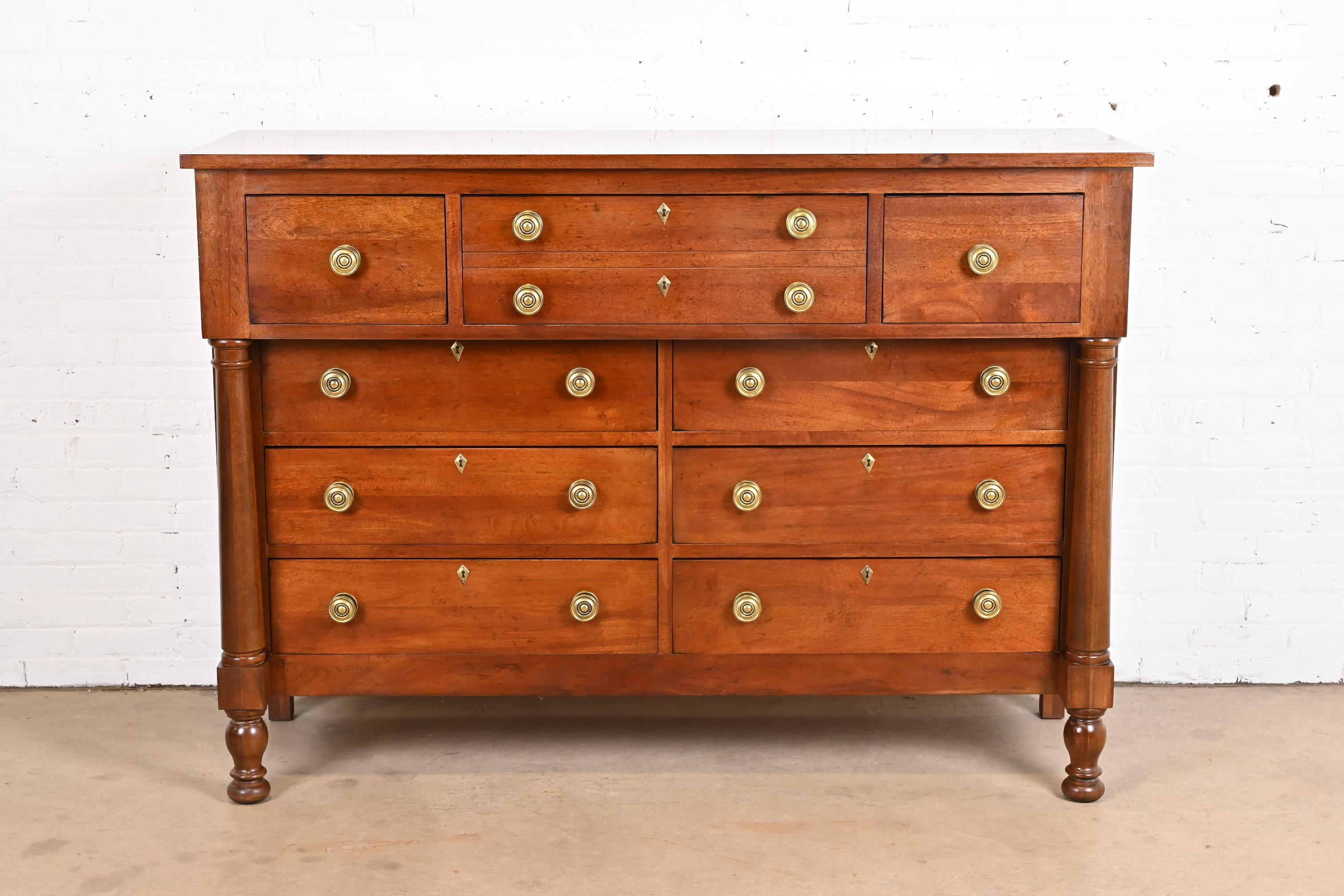 An exceptional French Empire style nine-drawer dresser or chest of drawers

By Henredon

USA, late 20th century

Carved mahogany, with original brass hardware.

Measures: 65