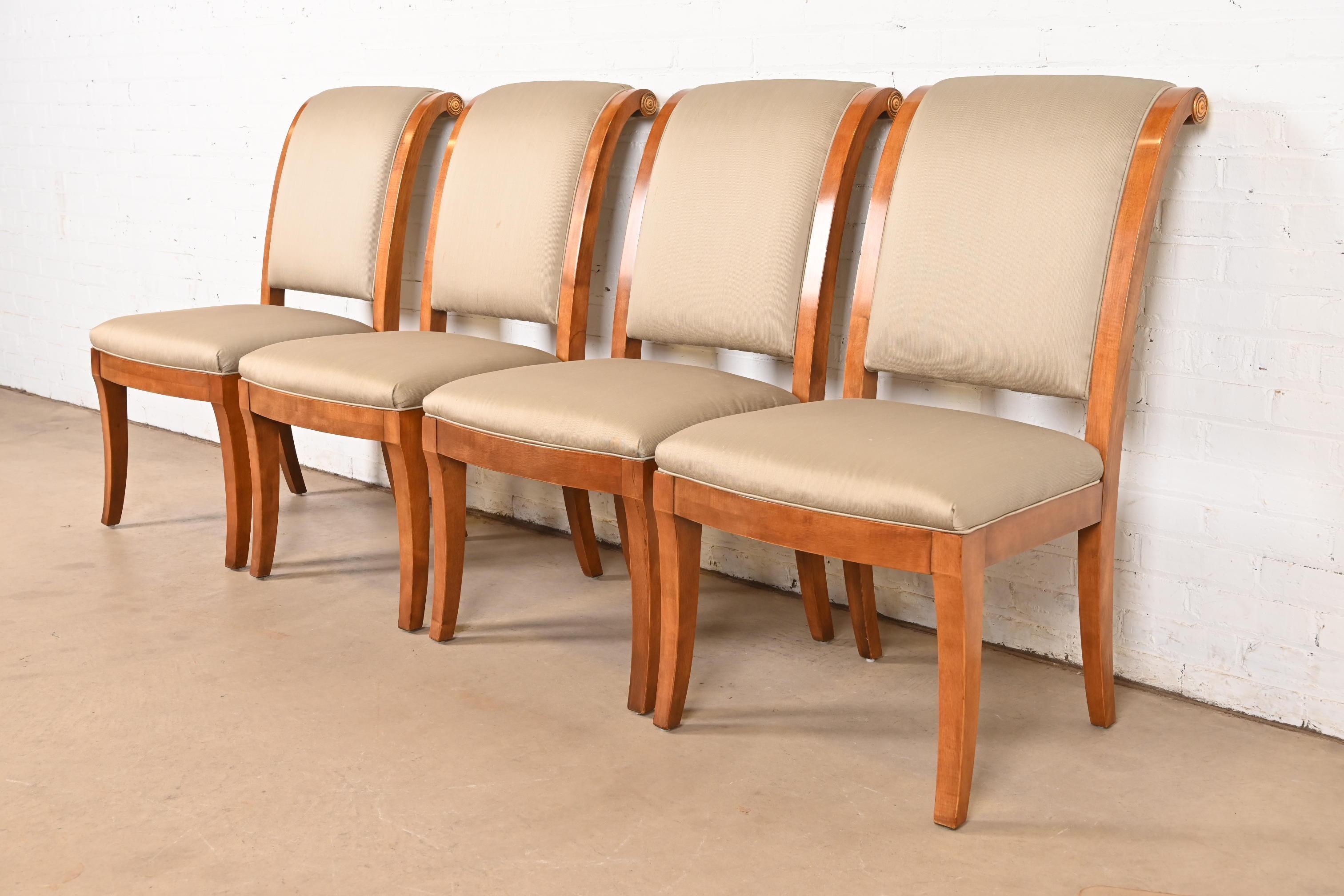 An outstanding set of four French Empire, Neoclassical, or Regency style side chairs or dining chairs

By Henredon

USA, Late 20th Century

Carved walnut frames, with giltwood accents, and upholstered seats and backs.

Measures: 22.5
