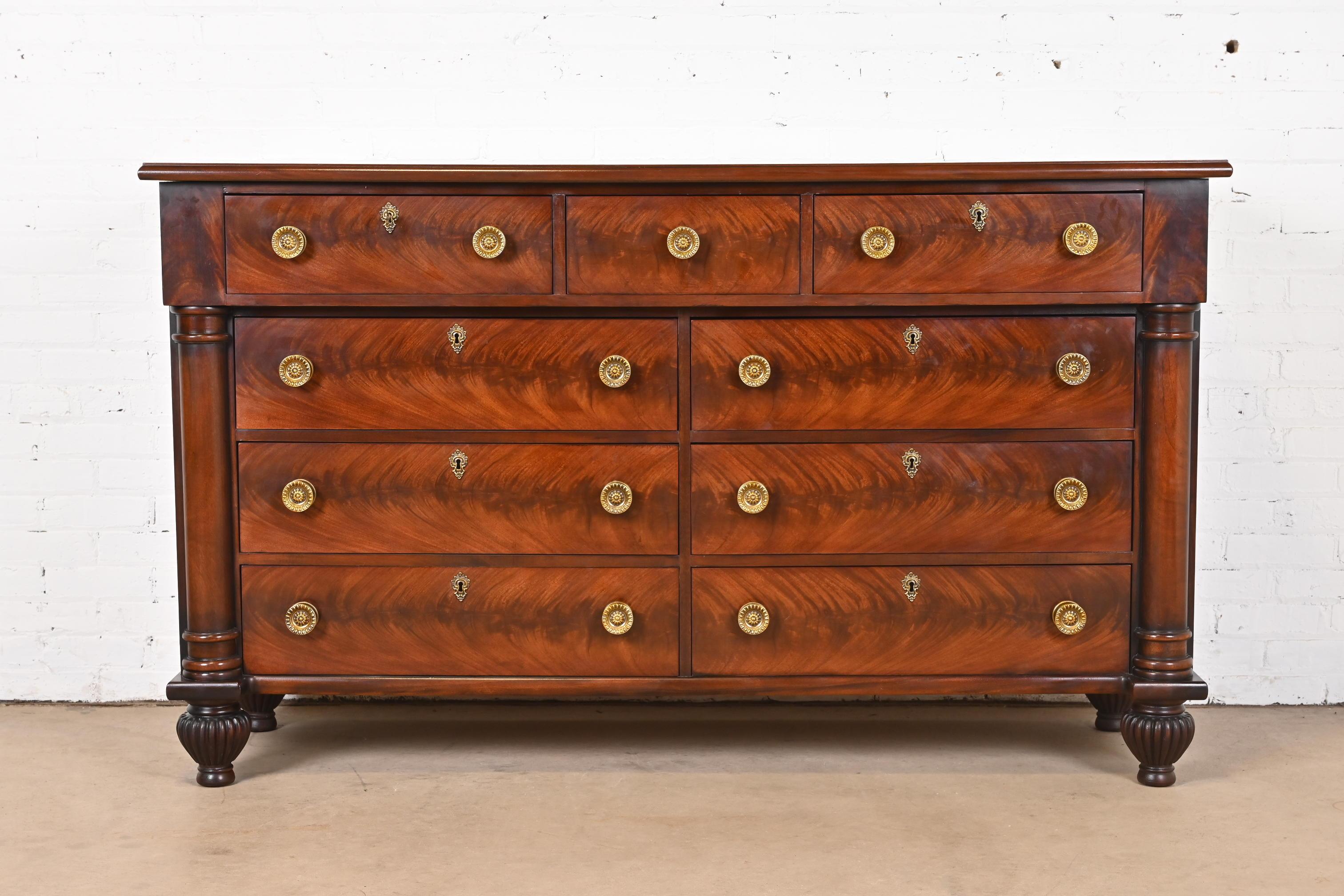 A gorgeous French Empire, Neoclassical, or Georgian style nine-drawer dresser or chest of drawers

In the manner of Ralph Lauren

By Henredon

USA, Late 20th Century

Beautiful book-matched flame mahogany, with carved mahogany columns and original