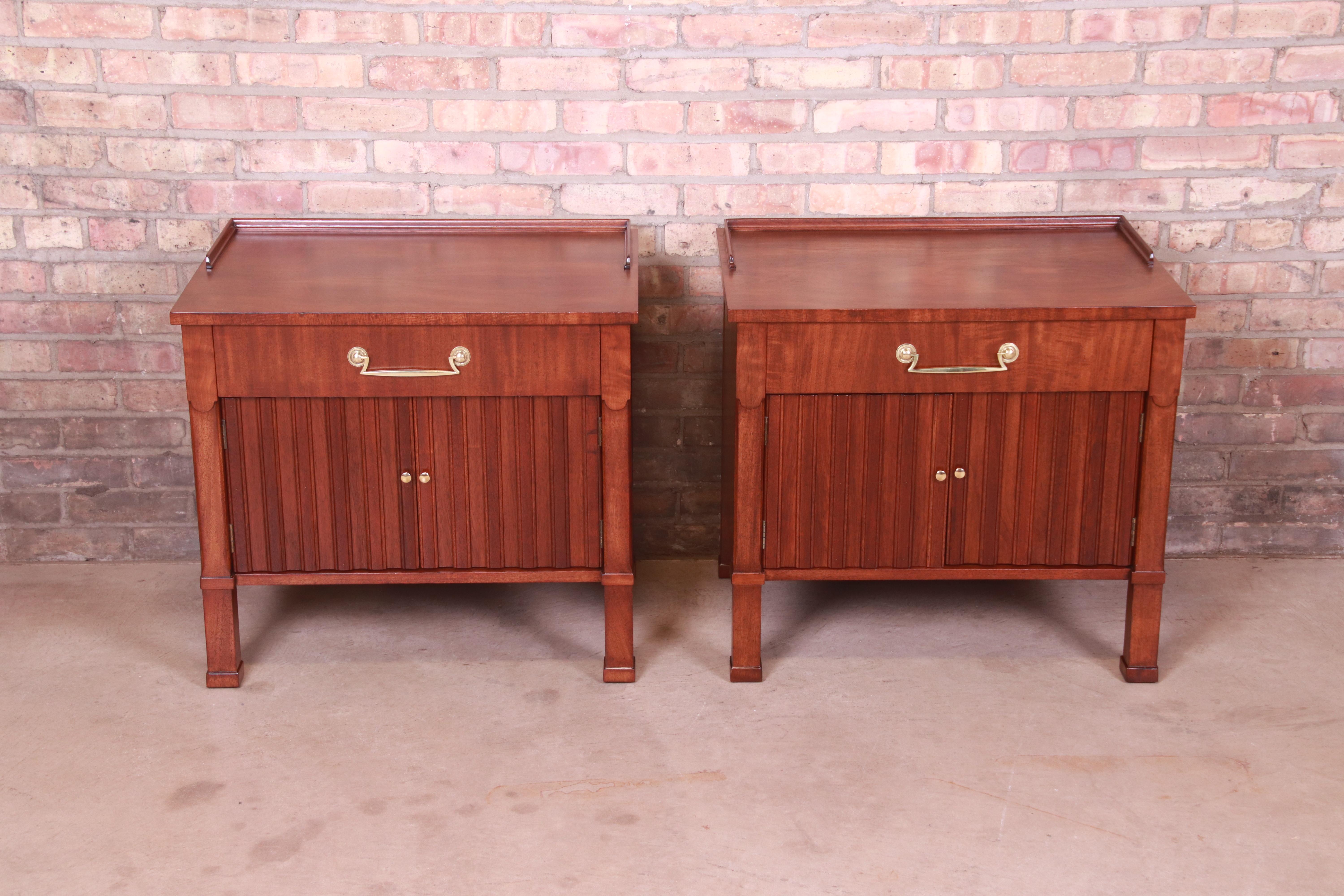 A gorgeous pair of French Empire style nightstands

By Henredon

USA, Circa 1960s

Mahogany, with original brass hardware.

Measures: 27