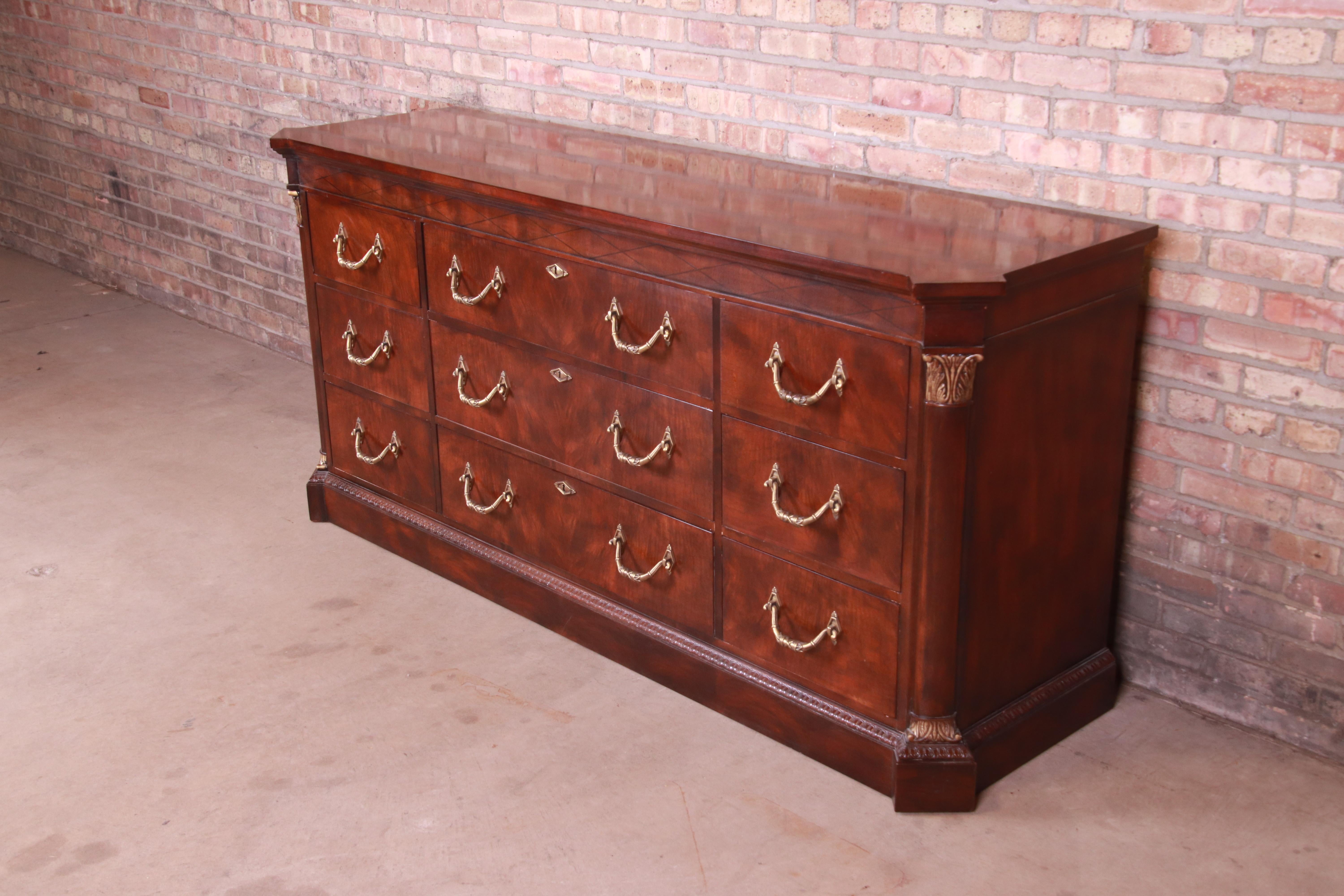 A gorgeous neoclassical or French Empire style nine-drawer triple dresser or credenza

By Henredon

USA, Circa 1980s

Mahogany, with giltwood details and original brass hardware.

Measures: 78.25