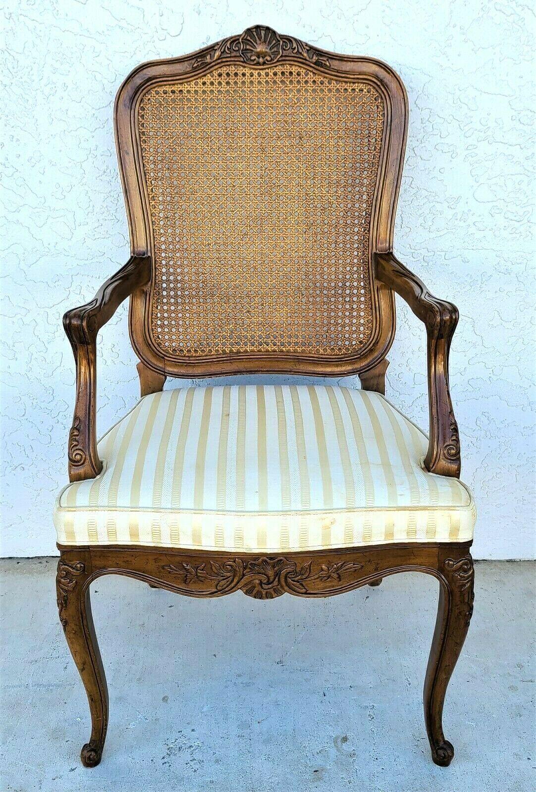 Offering one of our recent palm beach estate fine furniture acquisitions of a set of 5 vintage Henredon French provincial cane back dining chairs Model 2377
Set includes 2 arm and 3 side chairs

Approximate Measurements in Inches
Side