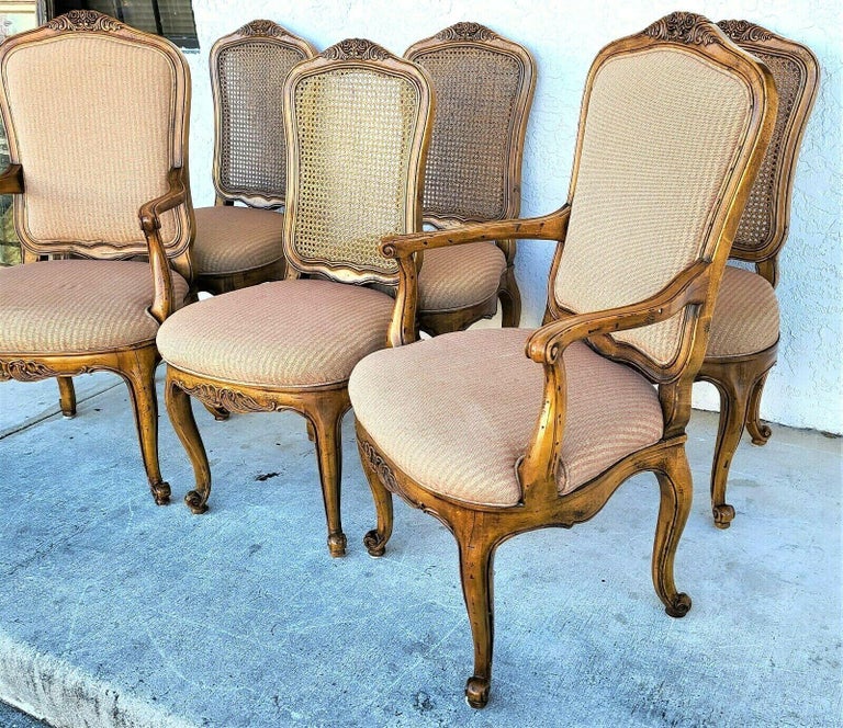 Offering one of our recent Palm Beach Estate fine furniture acquisitions of a set of 6 vintage henredon French Provincial cane back dining chairs
Set includes 2 arm and 4 side chairs. 

Approximate measurements in inches
Side chairs:
39