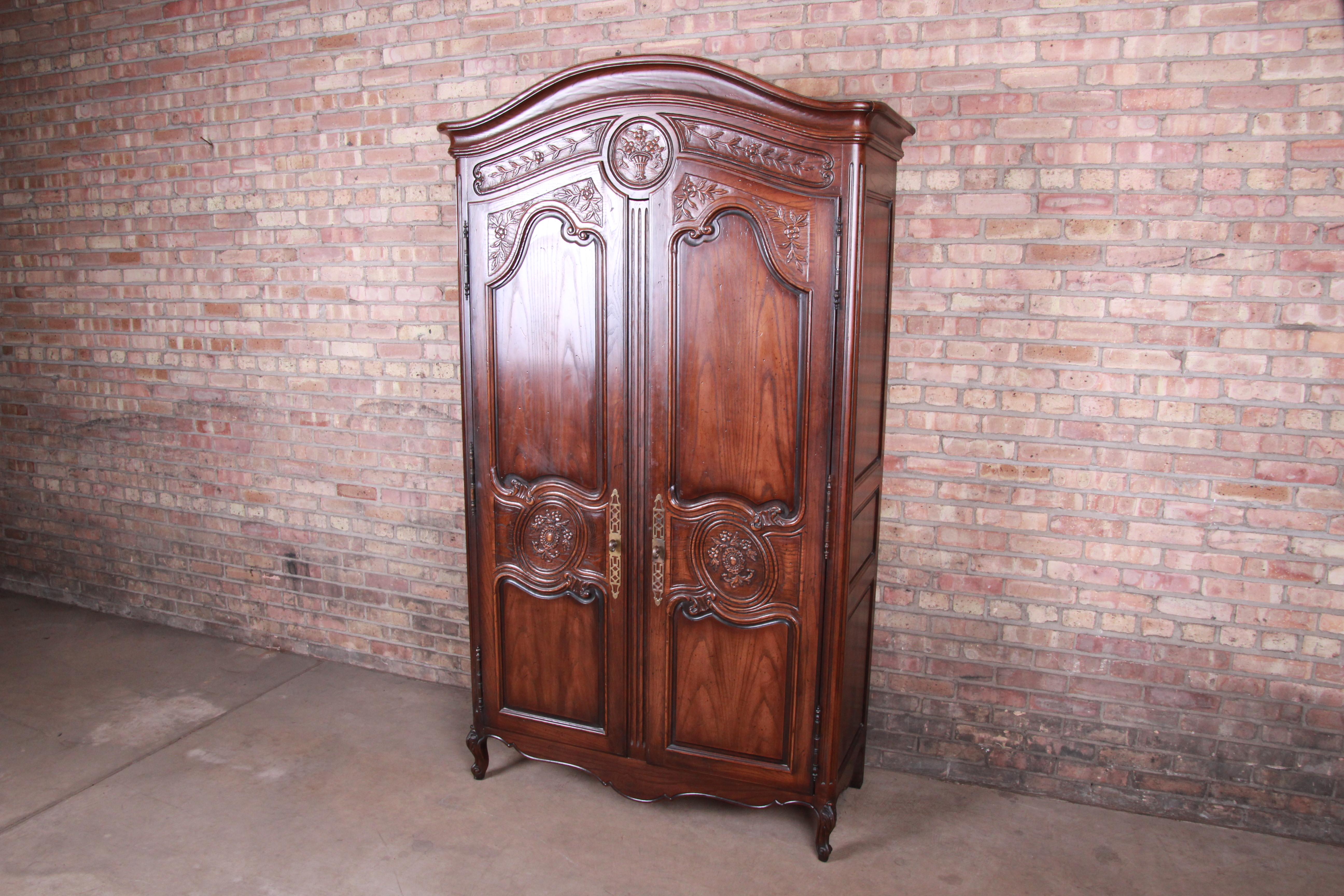 A gorgeous French Provincial Louis XV style armoire dresser

By Henredon 