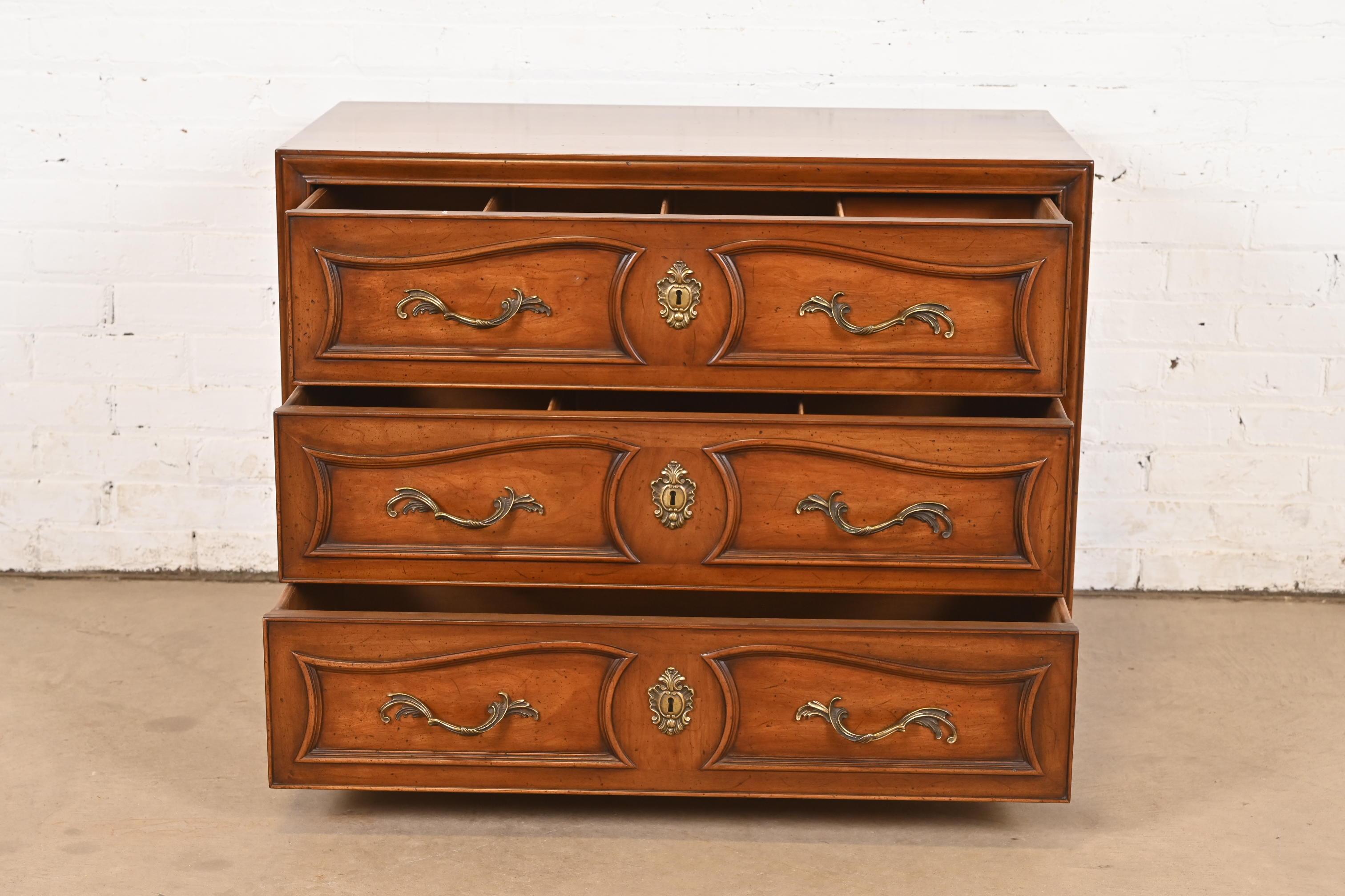 Brass Henredon French Provincial Louis XV Carved Walnut Chest of Drawers, Circa 1960s For Sale
