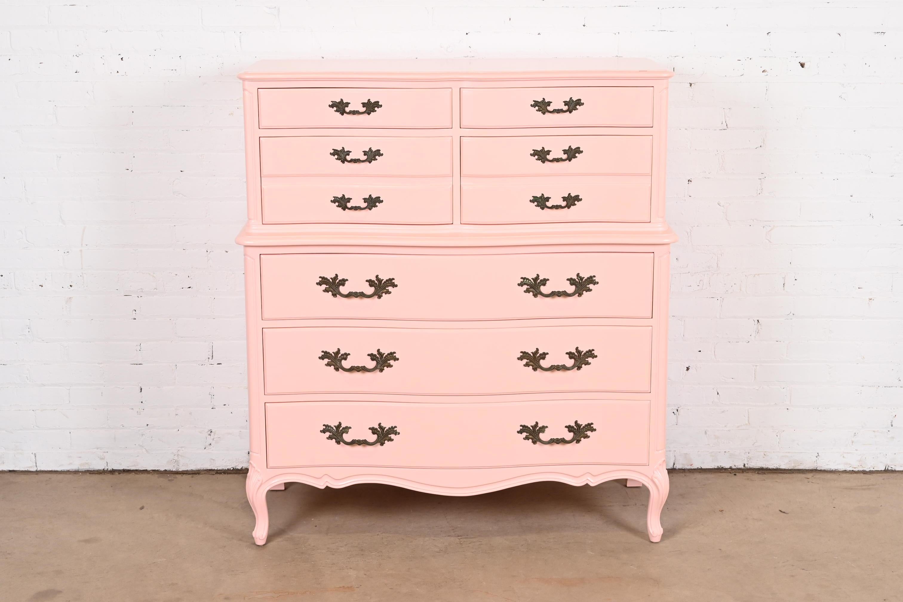 A gorgeous French Provincial Louis XV style seven-drawer highboy dresser

By Henredon

USA, Circa 1960s

Pink lacquered solid cherry wood, with original brass hardware.

Measures: 44