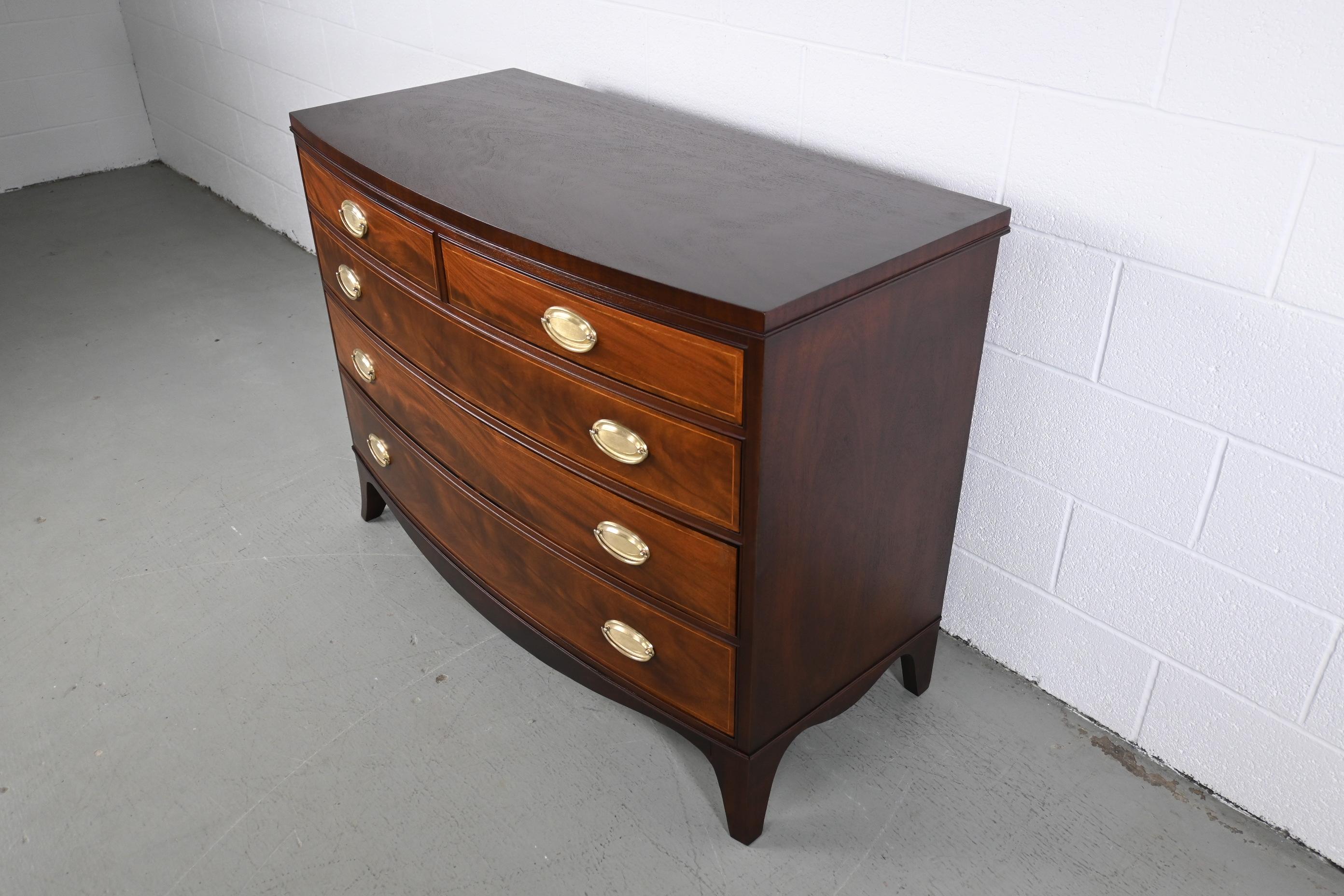 Henredon Furniture bow front hepplewhite style five drawer dresser.

Henredon Furniture, USA 1950s

Measures: 46 wide x 21.88 deep x 34.88 high

Hepplewhite style mahogany five drawer dresser with polished brass hardware.

Professionally