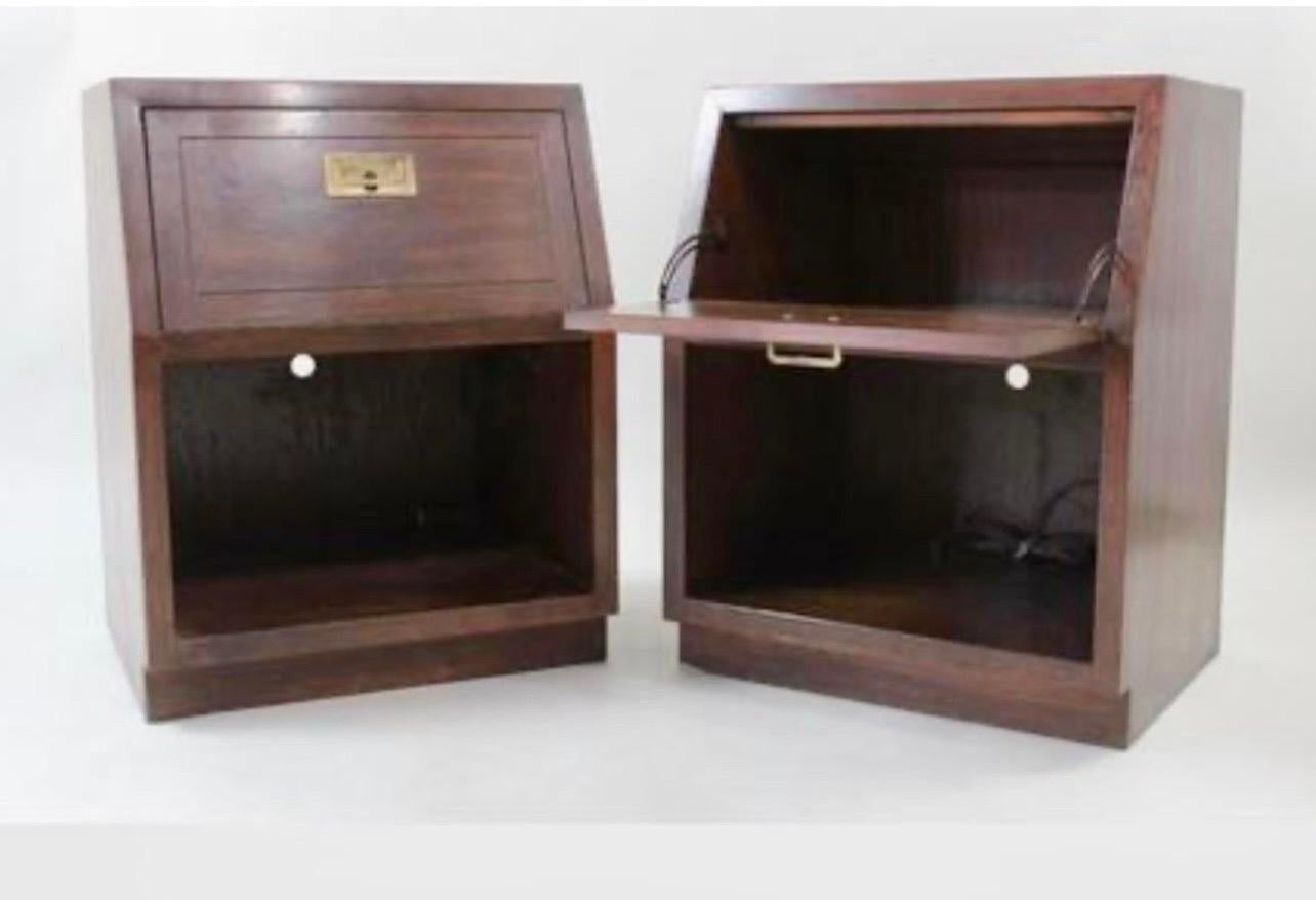 Coveted pair of iconic Mid-Century Modern Campaign style nightstands/end tables by Henredon. All hallmarks present. Great lines, scale and storage!
Note the drop fronts!