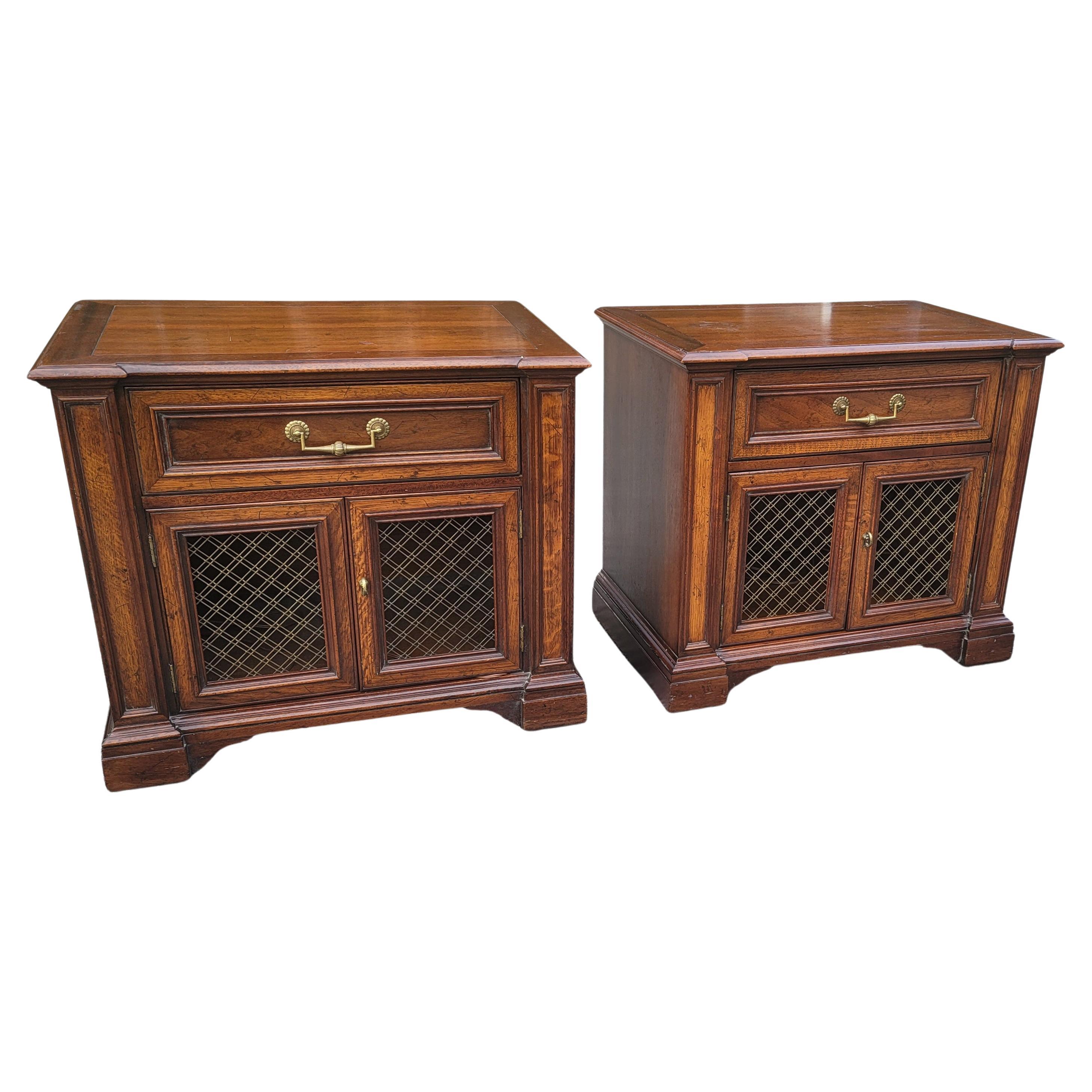 A beautiful pair of Henredon Fine Furniture French Wire Mesh Bedside Tables in good vintage condition. Built with and astonishing combination of solid walnut and mission oak woods. Measure 28