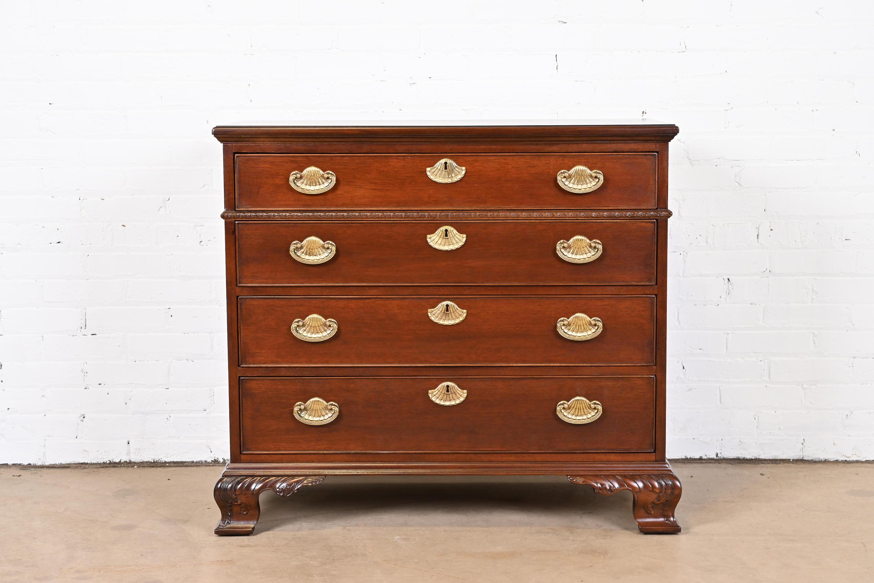 A gorgeous Georgian or Chippendale style dresser or chest of drawers

By Henredon

USA, Late 20th Century

Solid carved mahogany, with original brass hardware.

Measures: 39