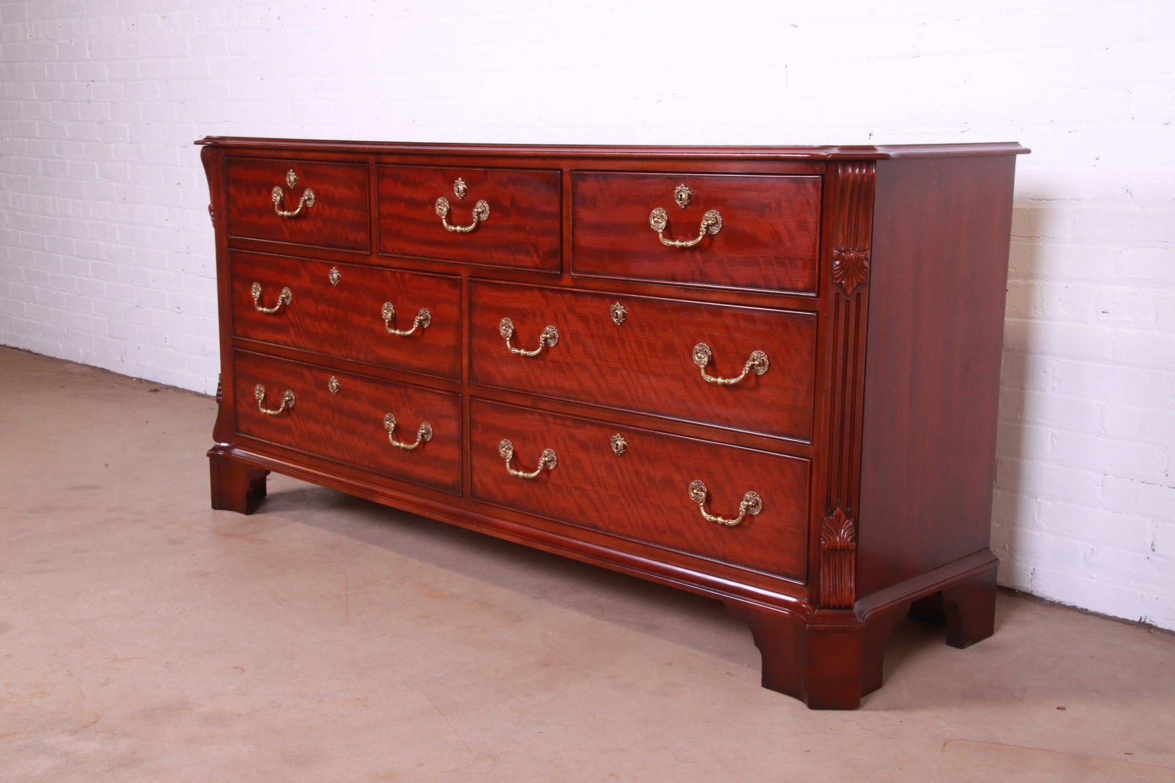A gorgeous Georgian or Chippendale style dresser or credenza

By Henredon

USA, Circa 1980s

Carved mahogany, with original brass hardware.

Measures: 72