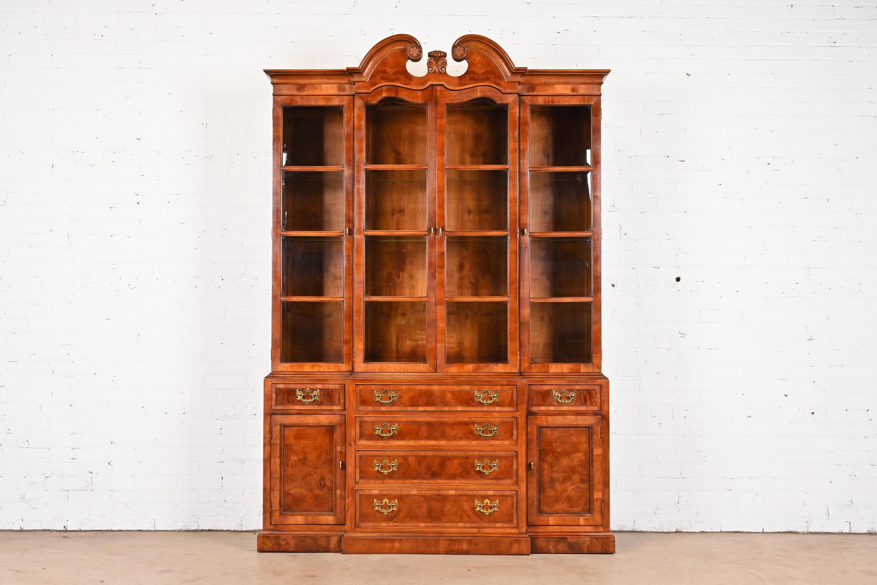 A gorgeous Georgian or Chippendale style lighted breakfront bookcase or dining cabinet

By Henredon, 