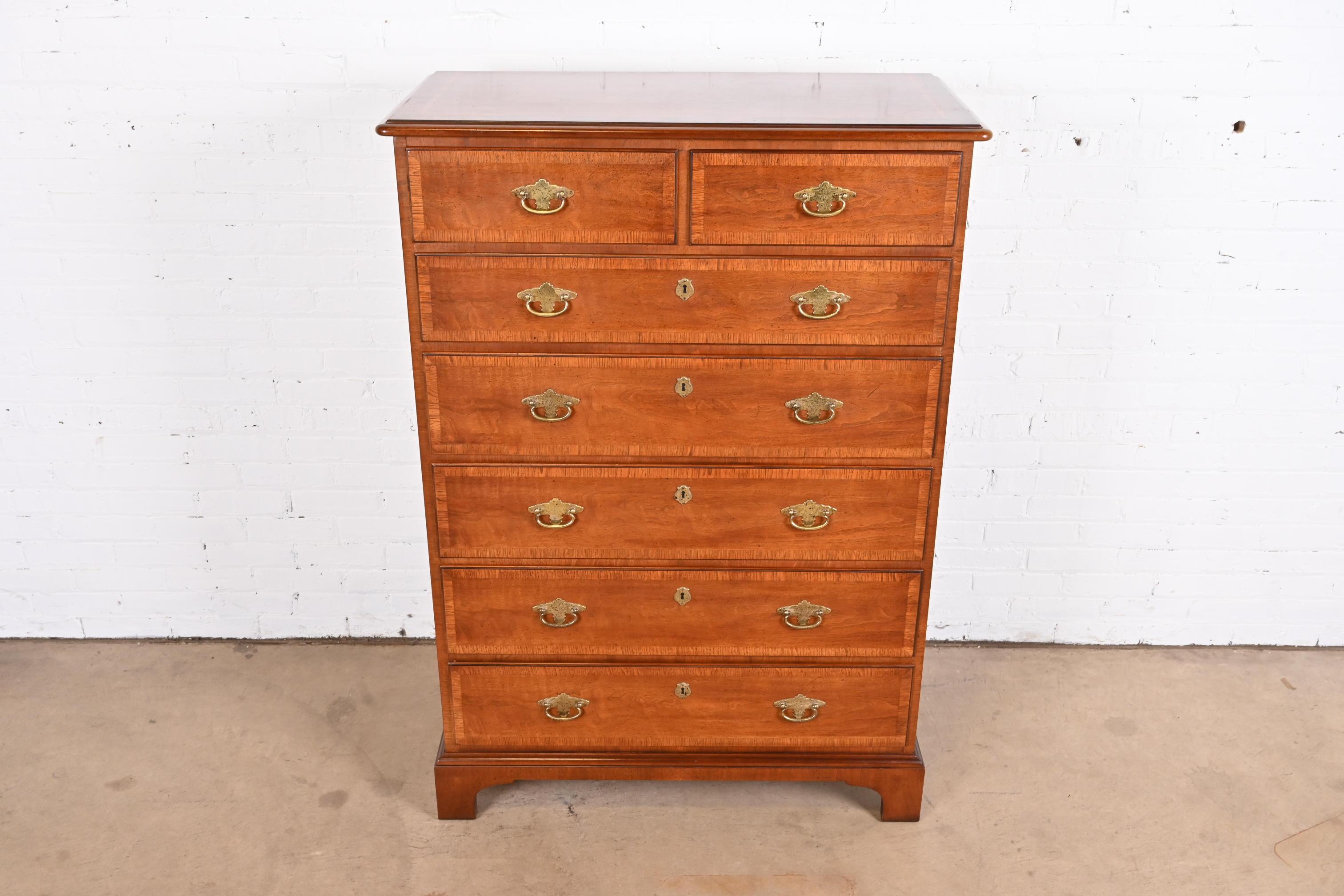 An exceptional Georgian style highboy dresser

By Henredon

USA, Circa 1980s

Gorgeous cherry wood, with mahogany banding and original brass hardware.

Measures: 38
