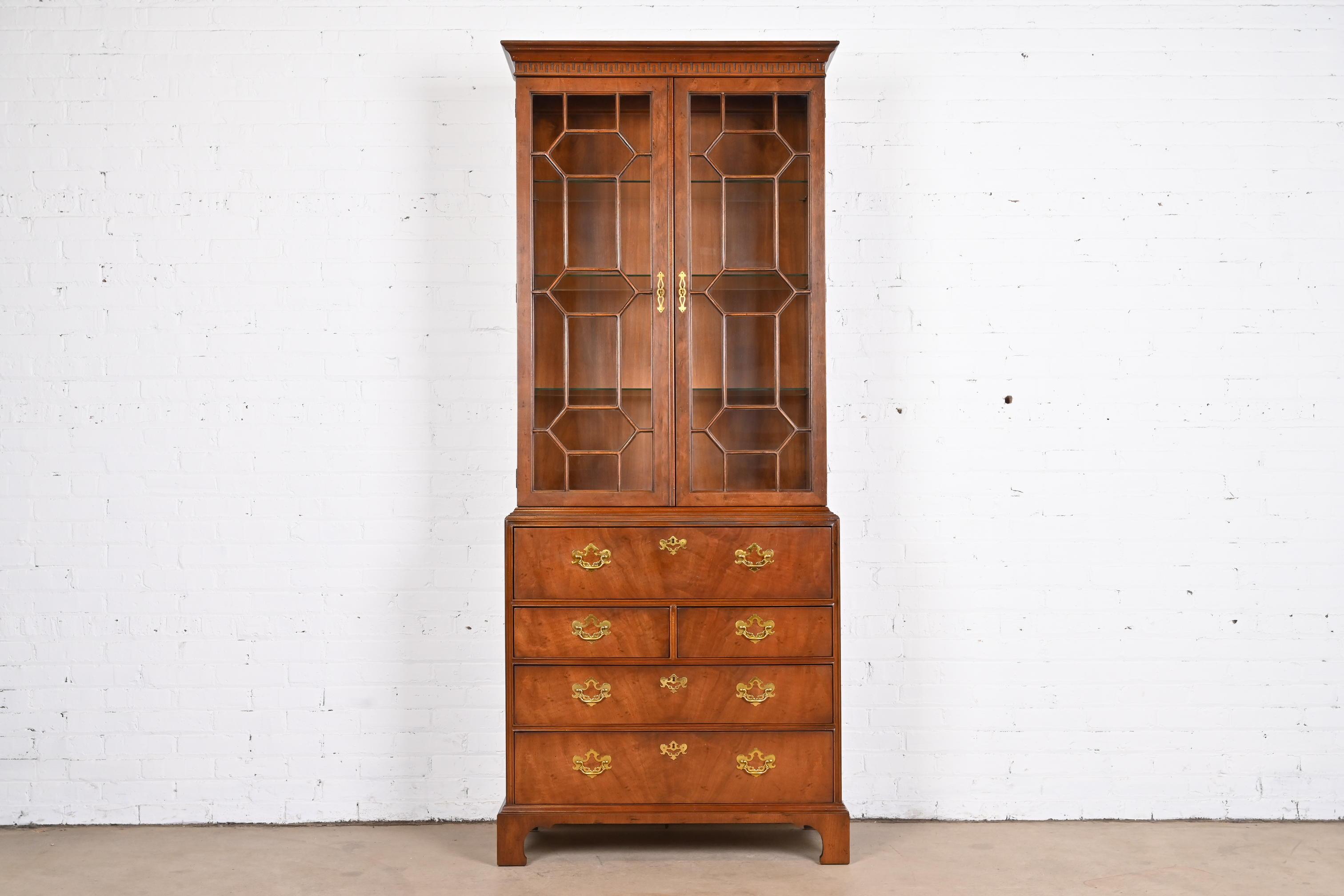 An exceptional Chippendale or Georgian style bureau with drop front secretary desk and lighted bookcase hutch top

By Henredon, 