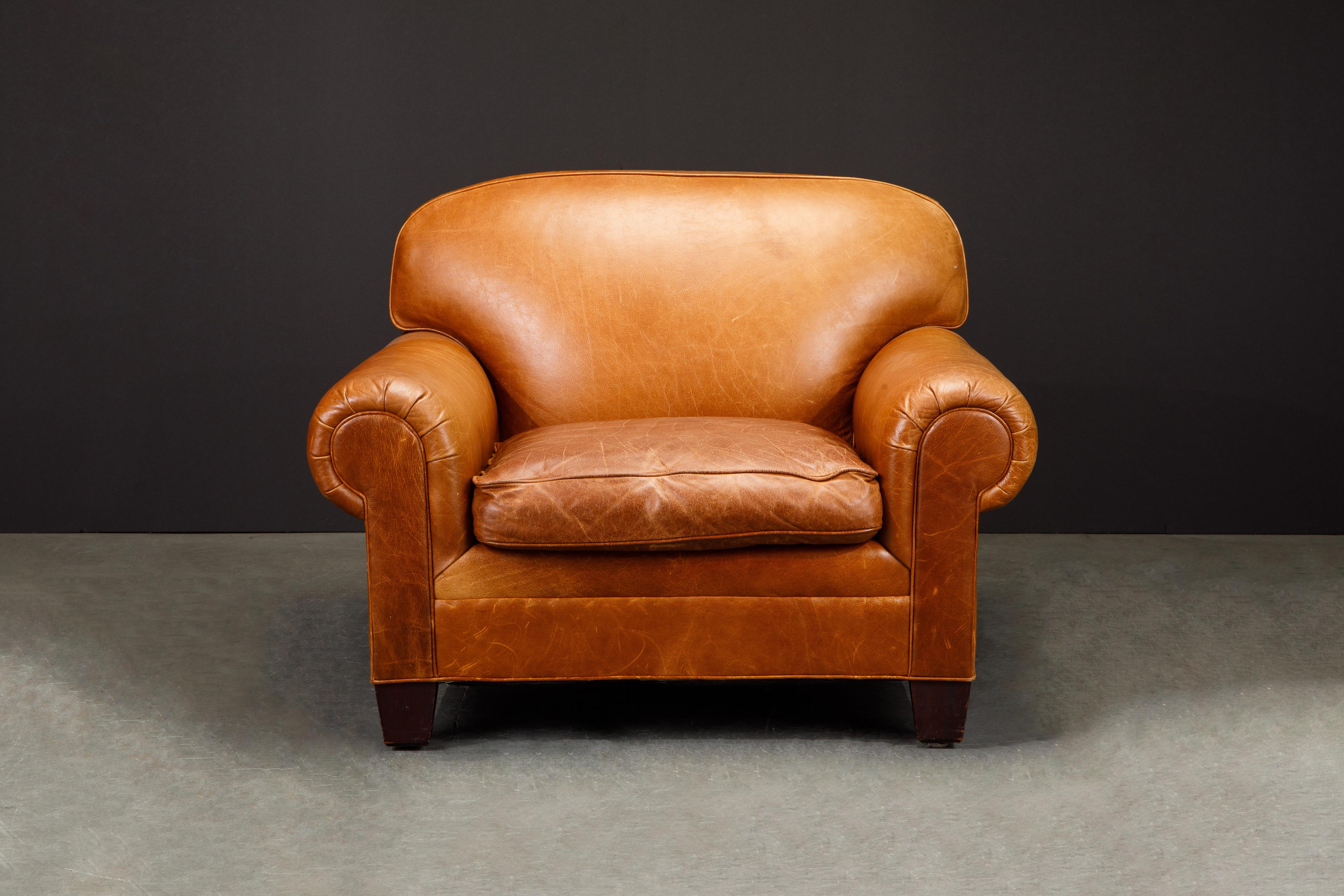 This gorgeous club chair and ottoman by Henredon for Ralph Lauren has such incredible lightly patinated leather, very thick and quality natural hides were used in it's making. 

This casual and laid-back yet refined club chair and ottoman is