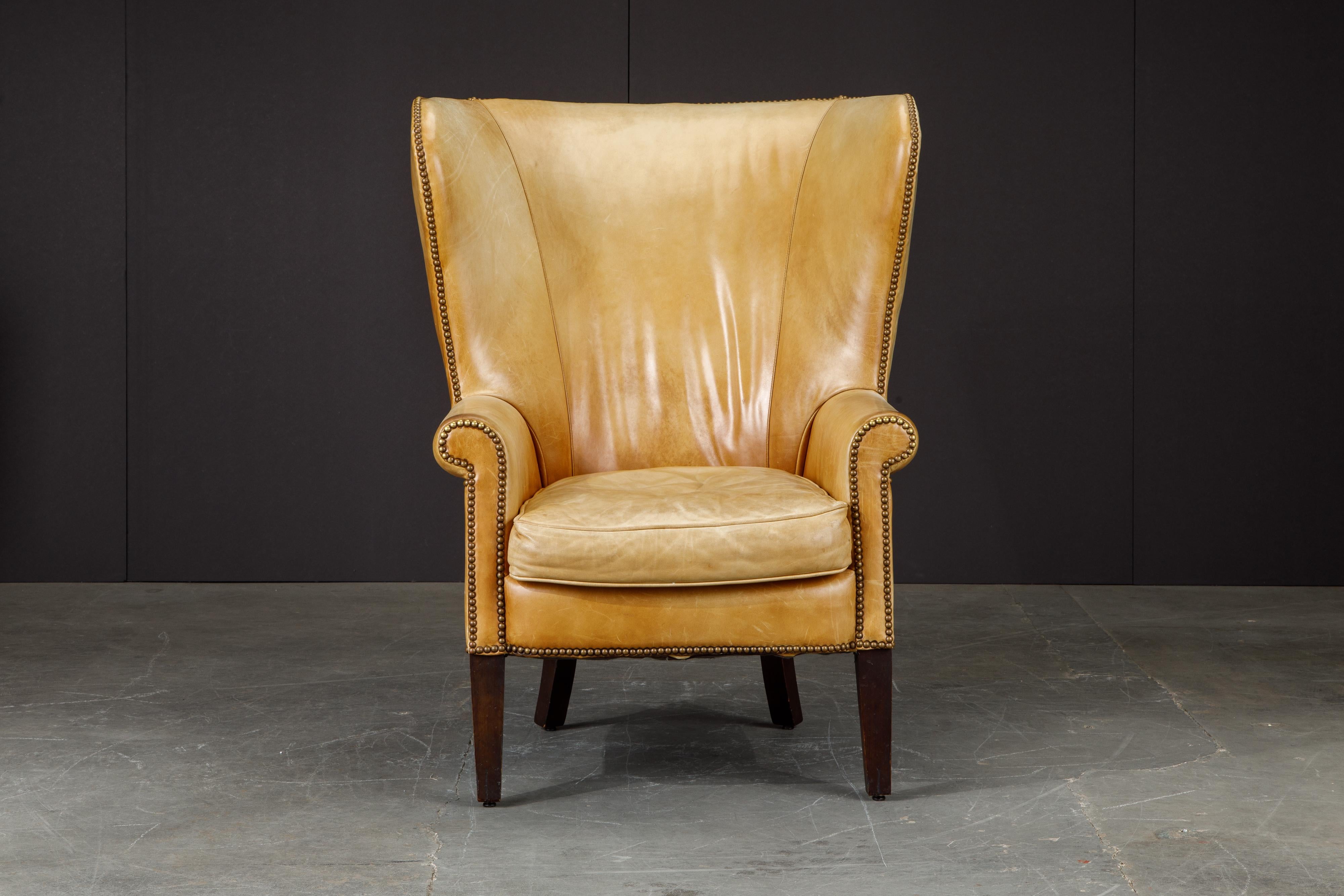 This gorgeous wingback club chair by Henredon for Ralph Lauren has such incredible lightly to moderately patinated leather, very thick and quality natural hides were used in it's making. 

The striking large scale wingback silhouette is iconic,