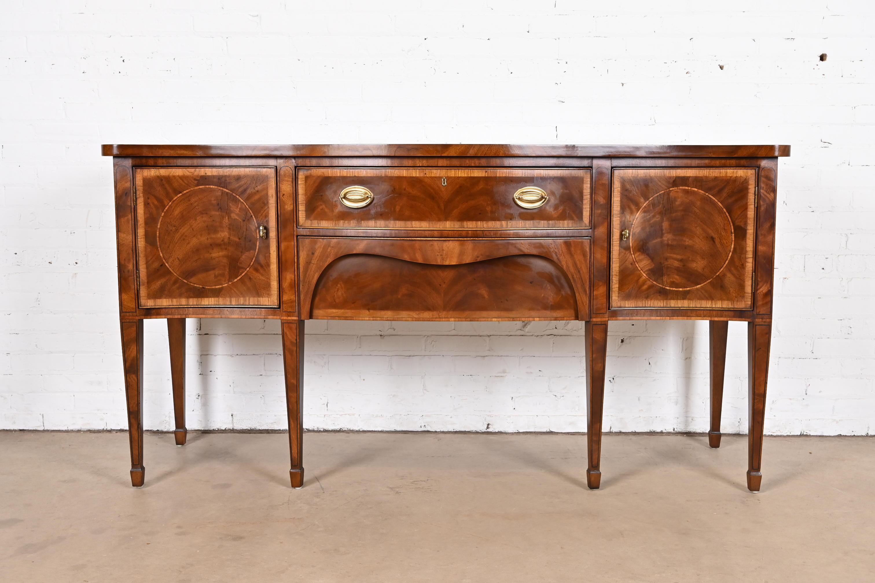 A gorgeous Hepplewhite or Federal style serpentine front sideboard buffet or credenza

By Henredon, 