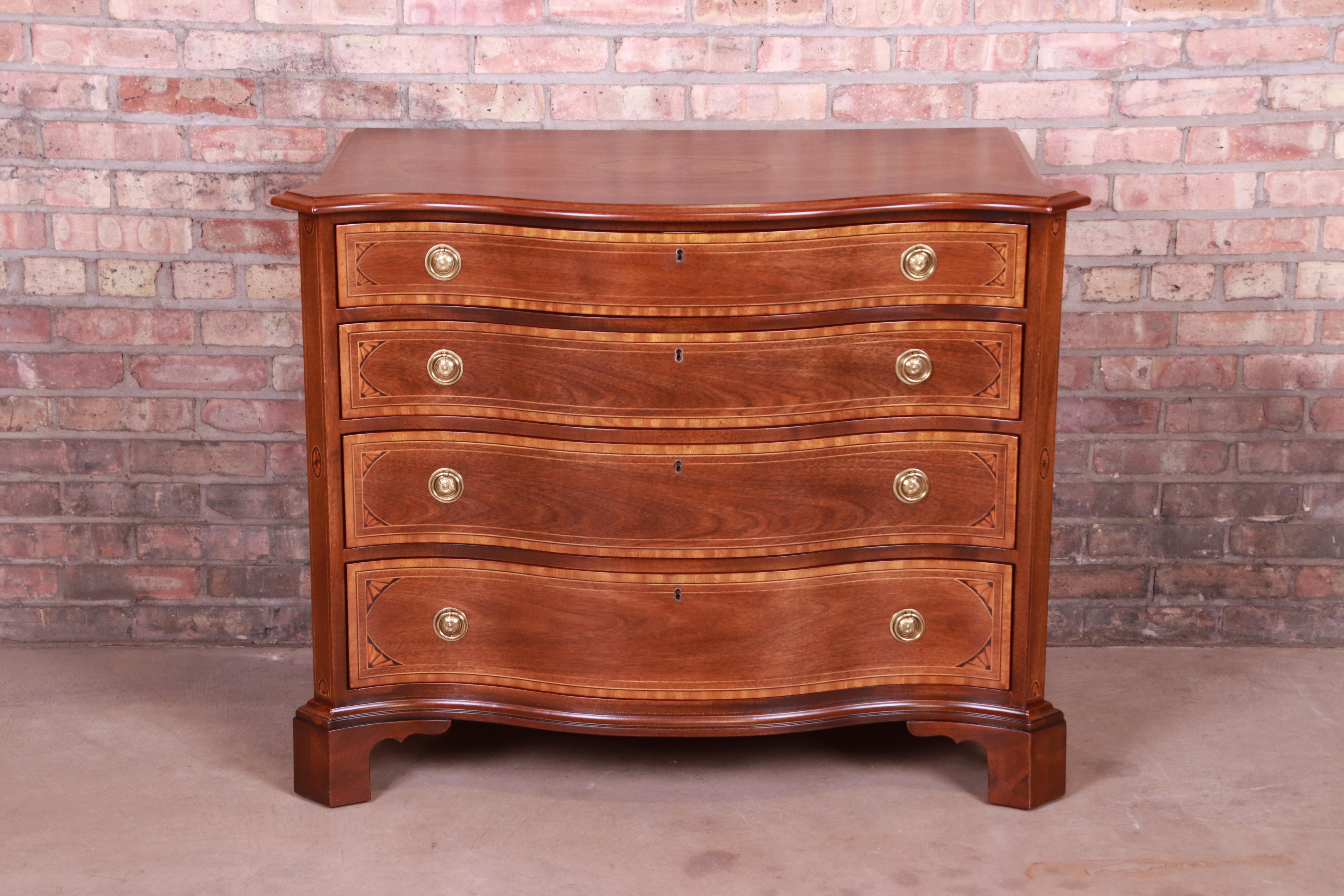 An exceptional Georgian style bow front commode or dresser

By Henredon 