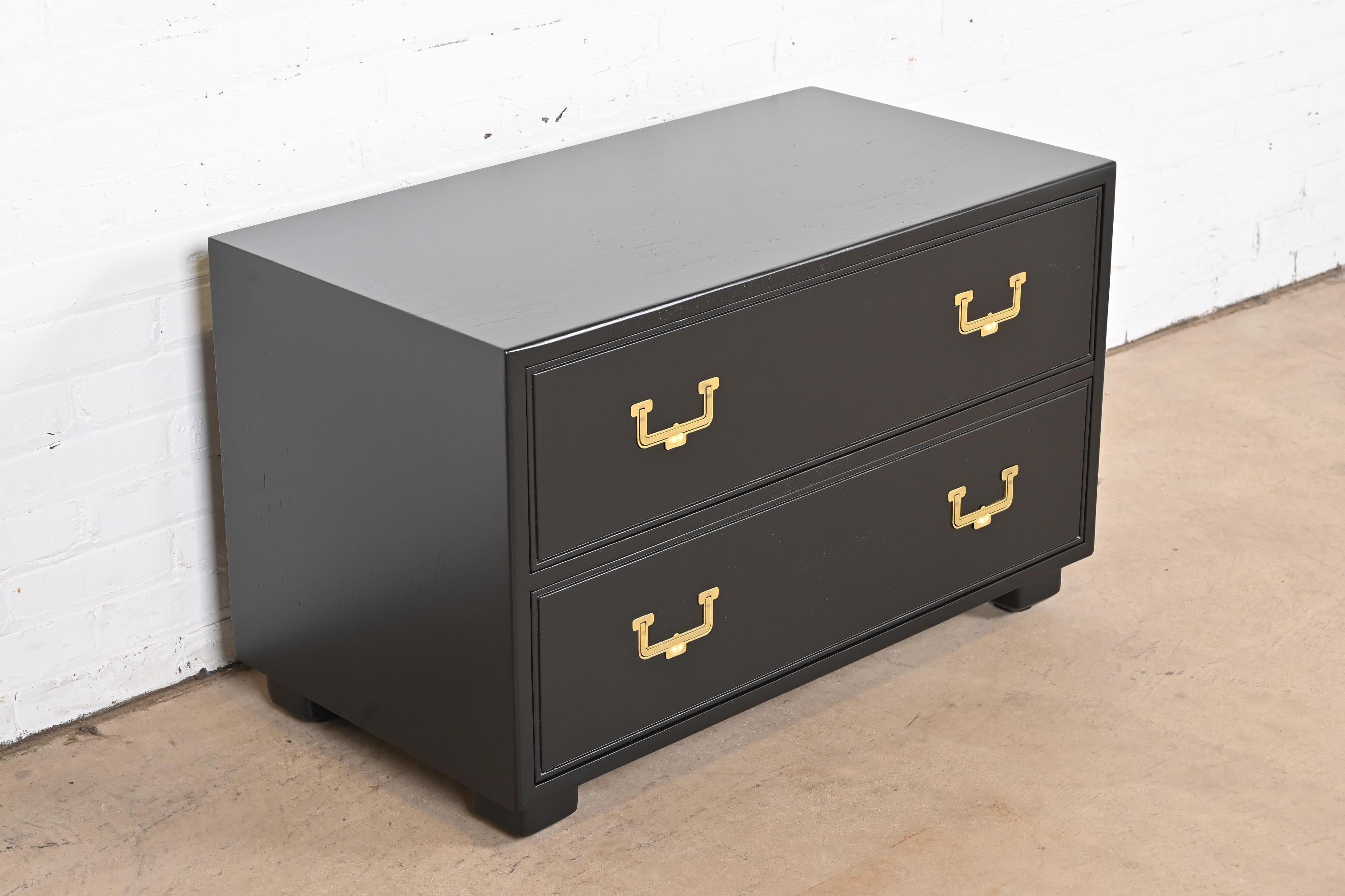 A gorgeous mid-century modern Hollywood Regency Campaign style two-drawer chest of drawers

By Henredon, 