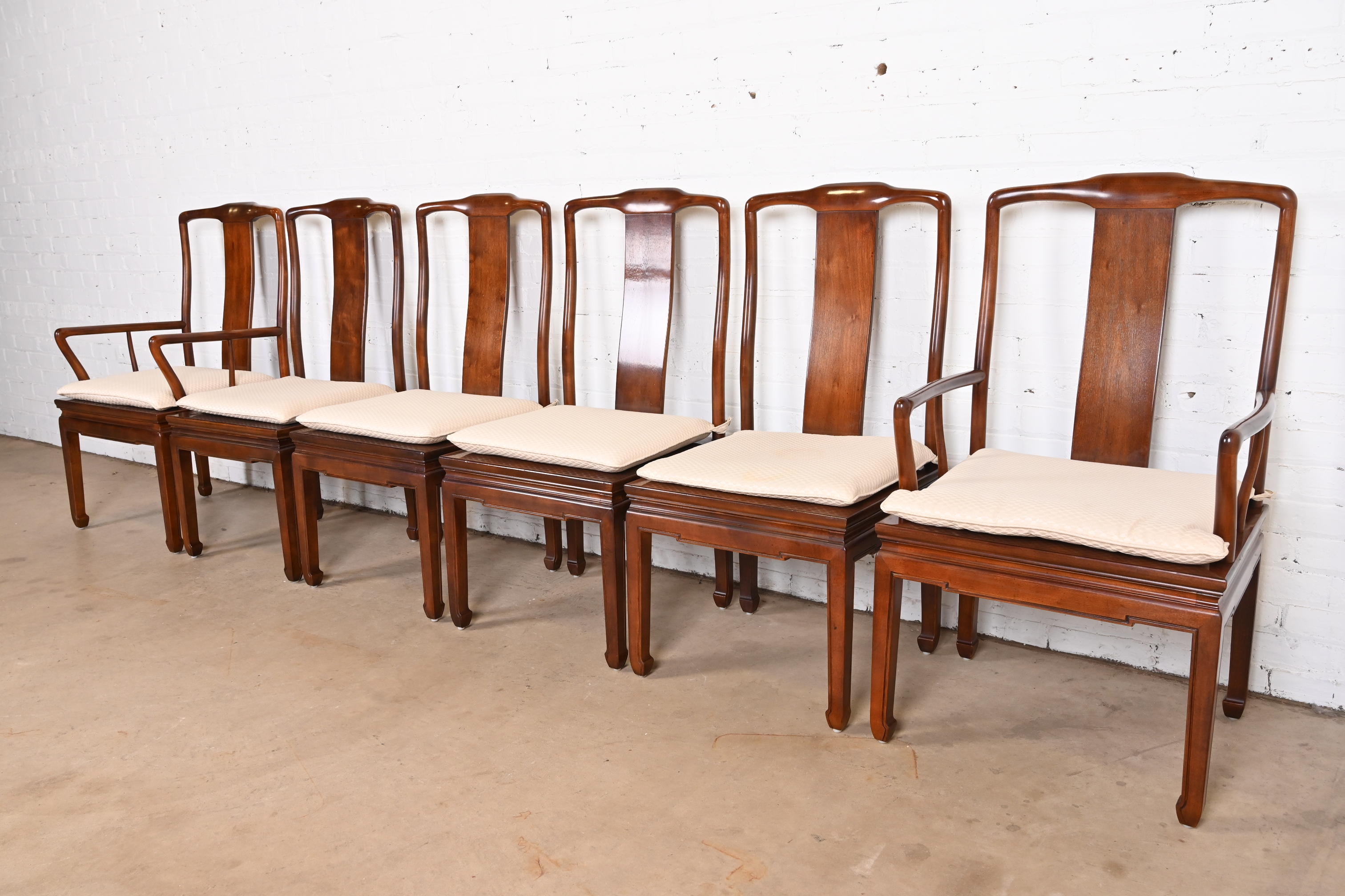 A gorgeous set of six mid-century modern Hollywood Regency Chinoiserie dining chairs

By Henredon

USA, Circa 1970s

Solid carved mahogany frames, with caned seats and upholstered seat cushions.

Measures:
Side chairs - 19.5