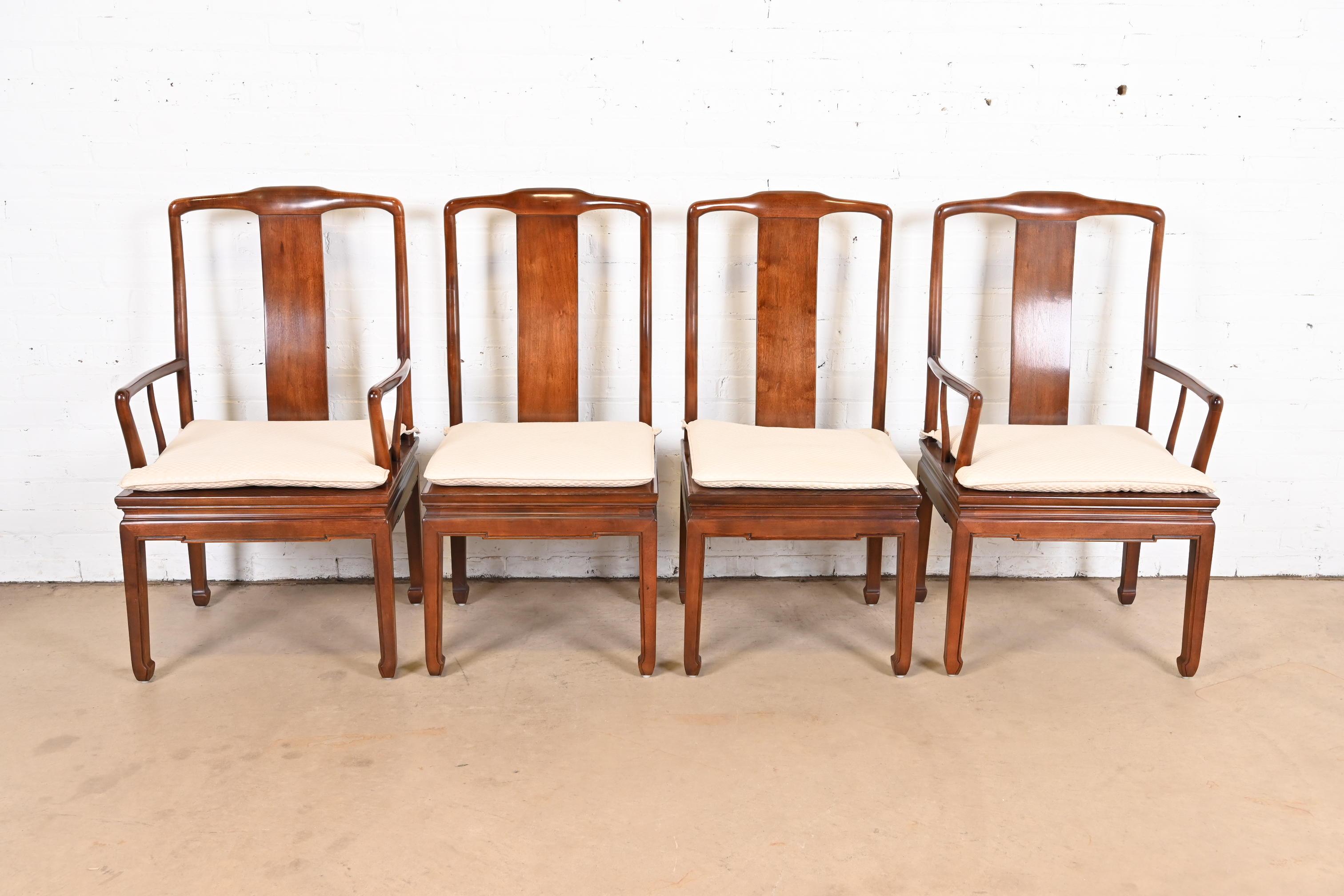 A gorgeous set of four mid-century modern Hollywood Regency Chinoiserie dining chairs

By Henredon

USA, Circa 1970s

Solid carved mahogany frames, with caned seats and upholstered seat cushions.

Measures:
Side chairs - 19.5
