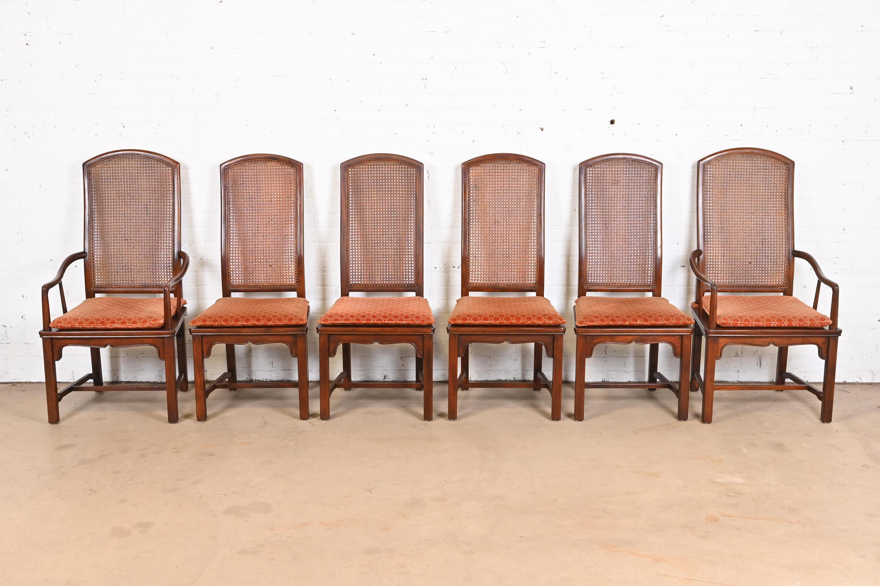 A gorgeous set of six mid-century modern Hollywood Regency Chinoiserie dining chairs

By Henredon

USA, Circa 1970s

Solid carved mahogany frames, with caned seats and backs, and removable upholstered seat cushions.

Measures:
Side chairs - 20