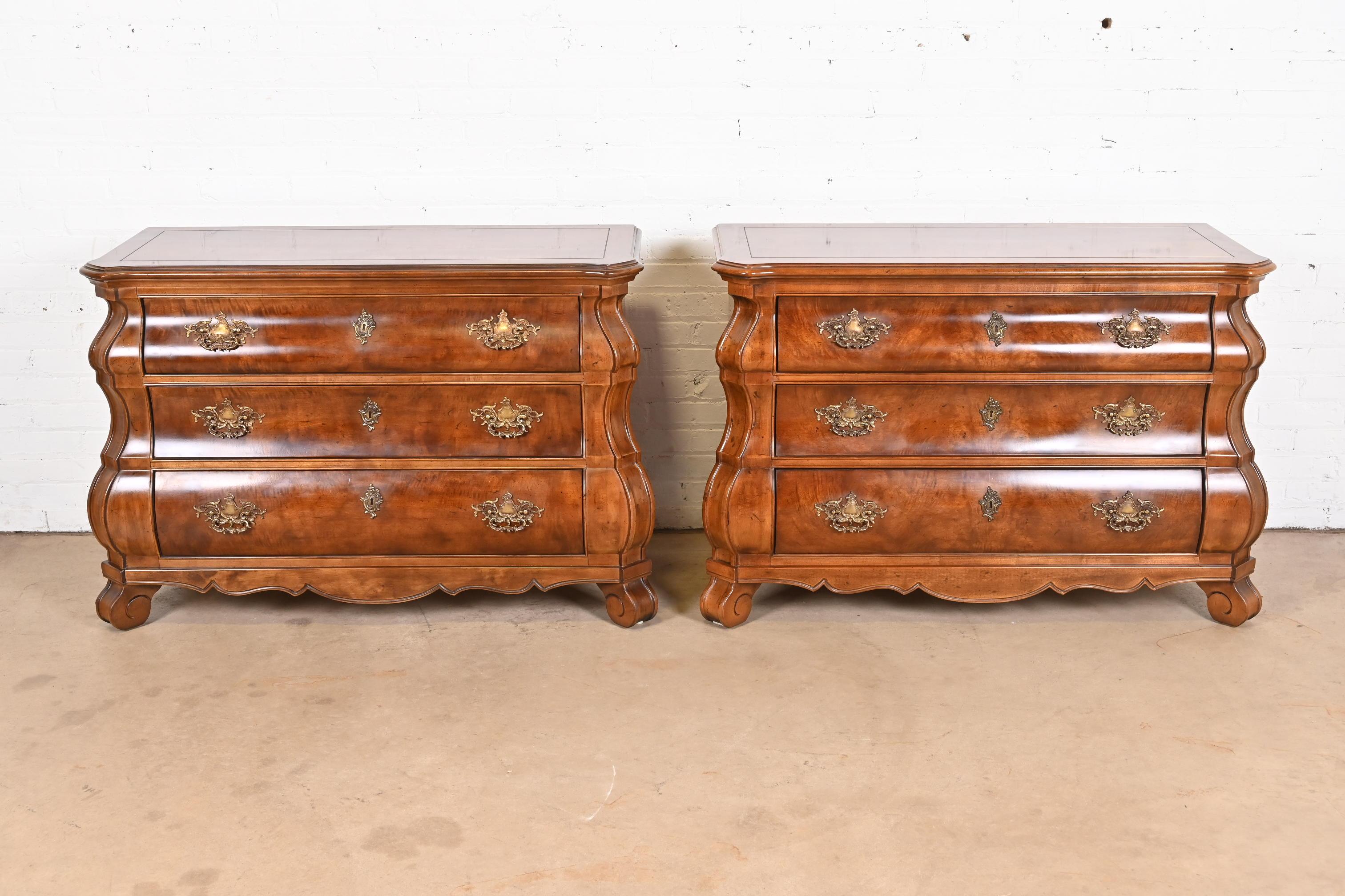 A gorgeous pair of Italian Baroque Louis XV style bombay form dressers or chests of drawers

By Henredon

USA, Circa 1980s

Beautiful burled mahogany, with original brass hardware.

Each measures: 48.5