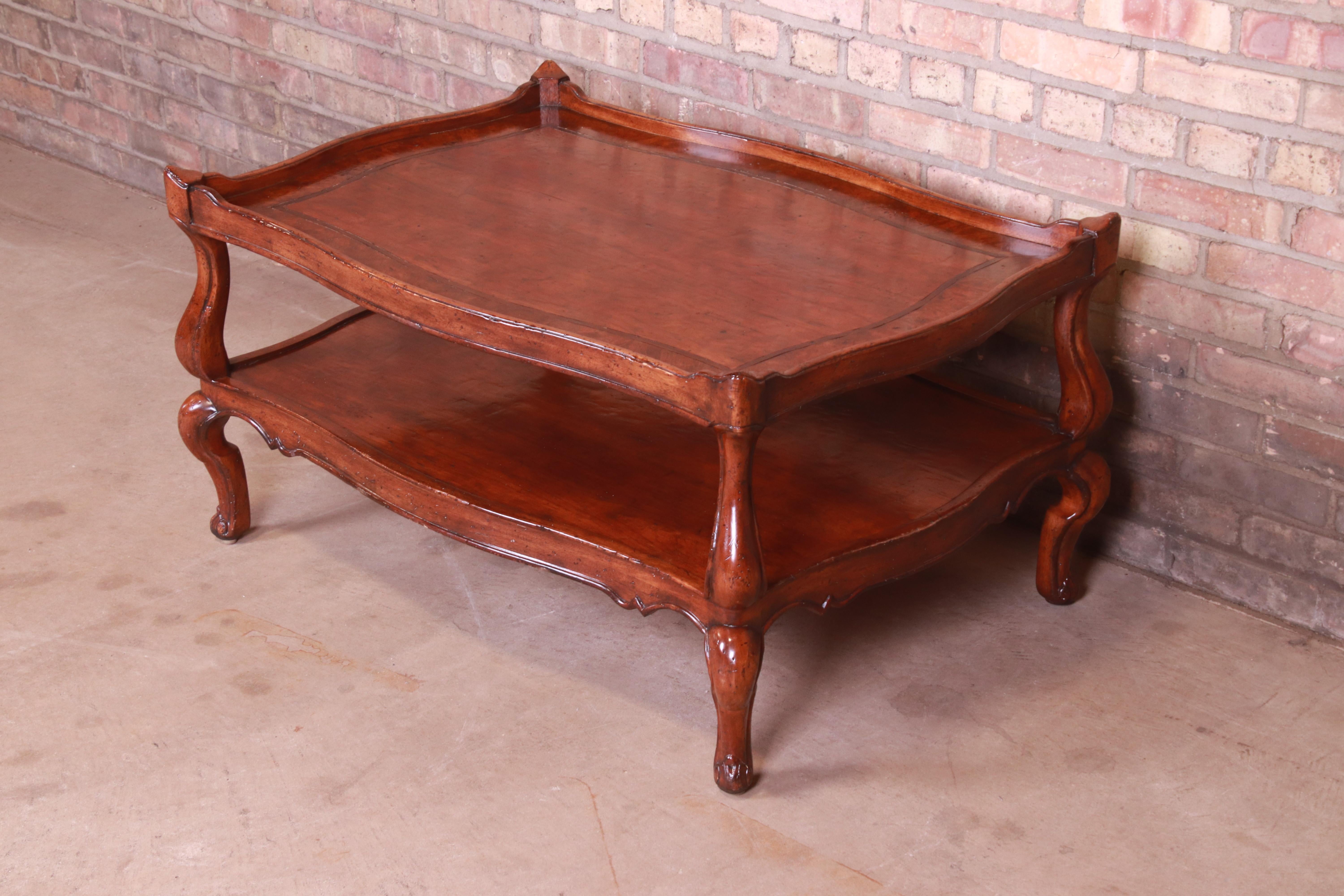 A gorgeous rustic Italian Provincial coffee or cocktail table

By Henredon

Colombia, 2007

Carved walnut, with burled walnut banding.

Measures: 38.75