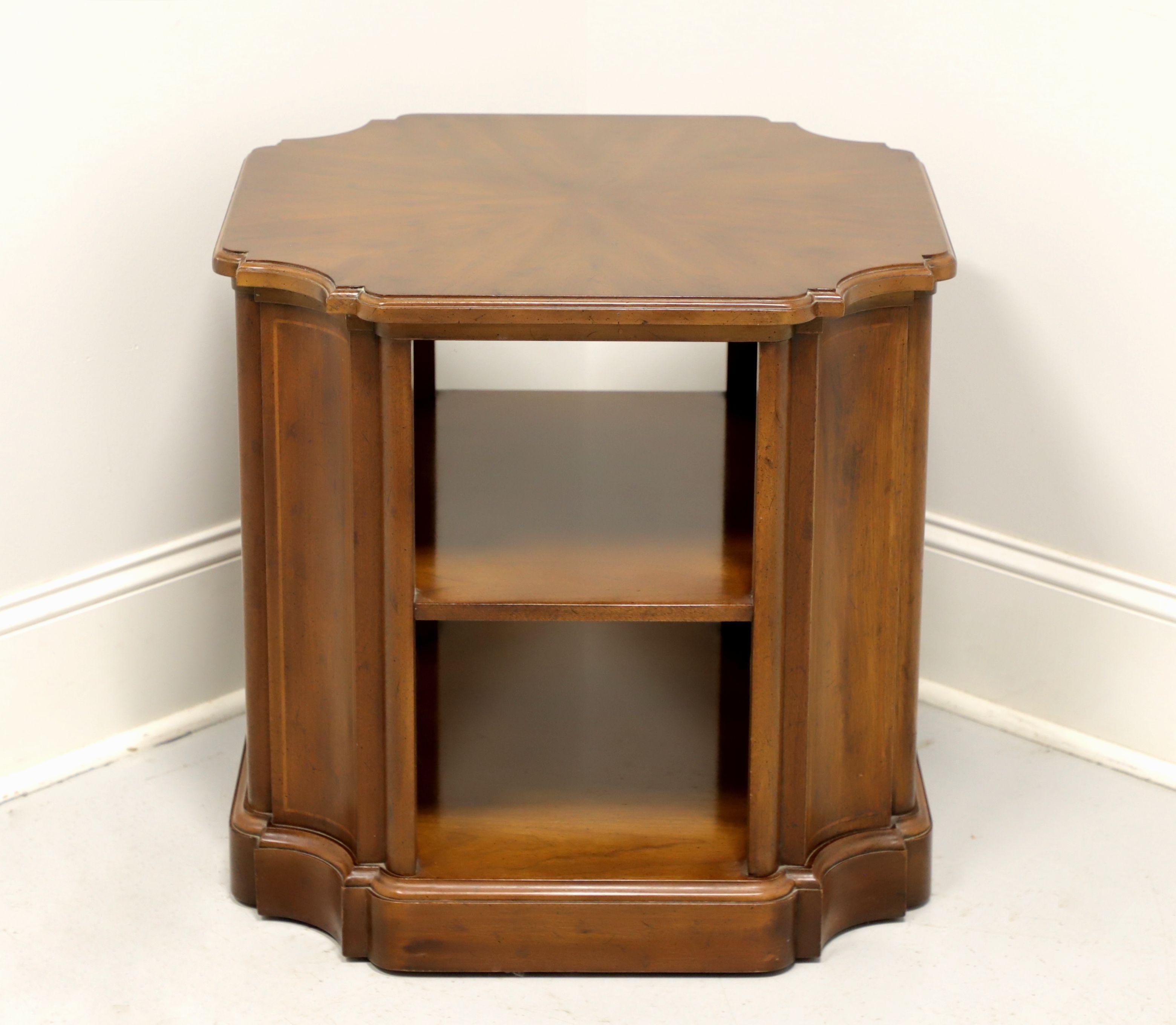 A Transitional style accent table by Henredon. Walnut with a slightly distressed finish. Features a unique modified octagonal shape with curved panels at four corners and two open shelves. Made in North Carolina, USA, in the late 20th