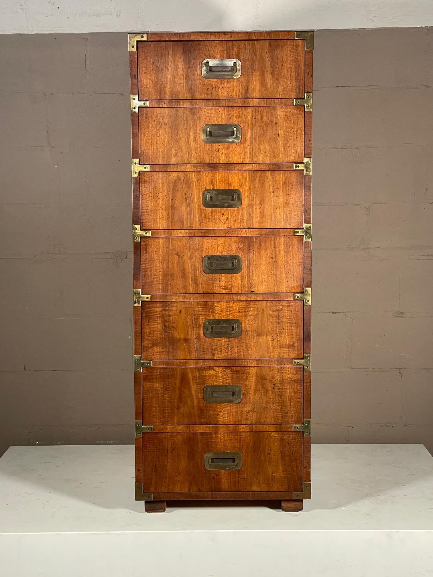 A classic campaign style seven drawer lingerie chest by Henredon with beautiful patina and graining.