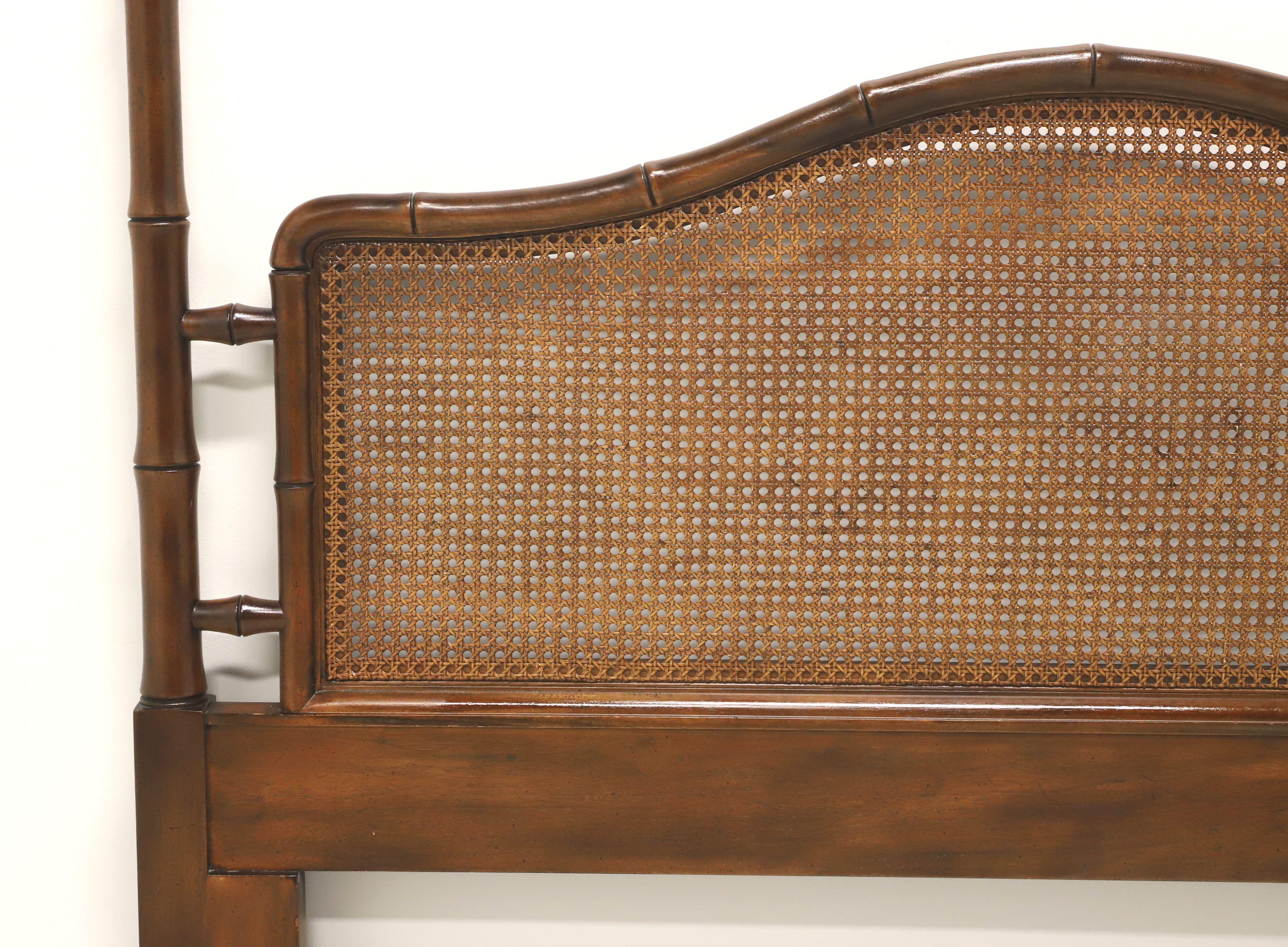 An Asian Chinoiserie style queen size headboard by Henredon. Mahogany with faux bamboo styling, two posts with finials and a center panel inset with cane on a solid base. Made in North Carolina, USA, in the late 20th Century. 

Measures:  60w 2.5d,