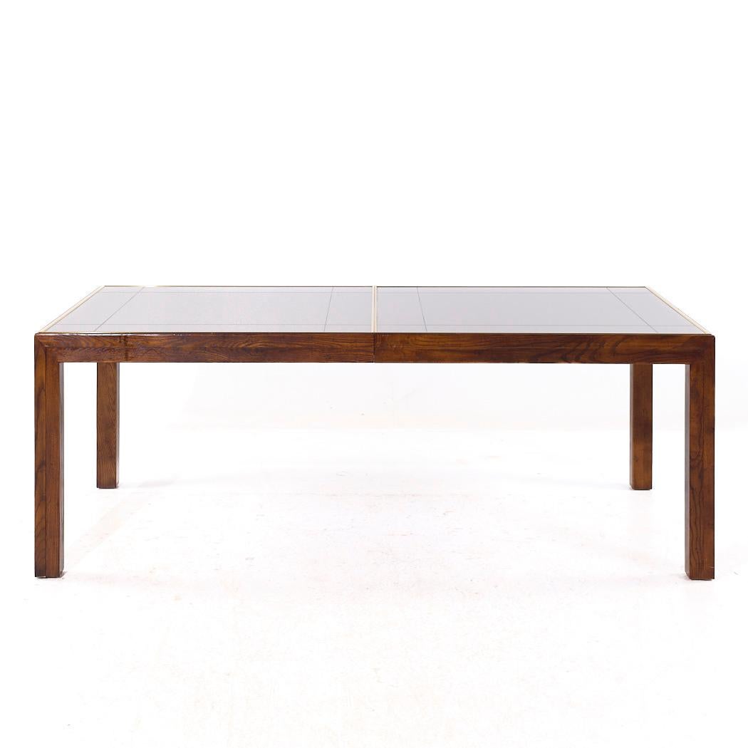 Henredon Mid Century Walnut and Mirrored Top Expanding Dining Table with 2 Leaves

This table measures: 81 wide x 41 deep x 29.25 inches high, with a chair clearance of 25.75 inches, each leaf measures 20 inches wide, making a maximum table width of