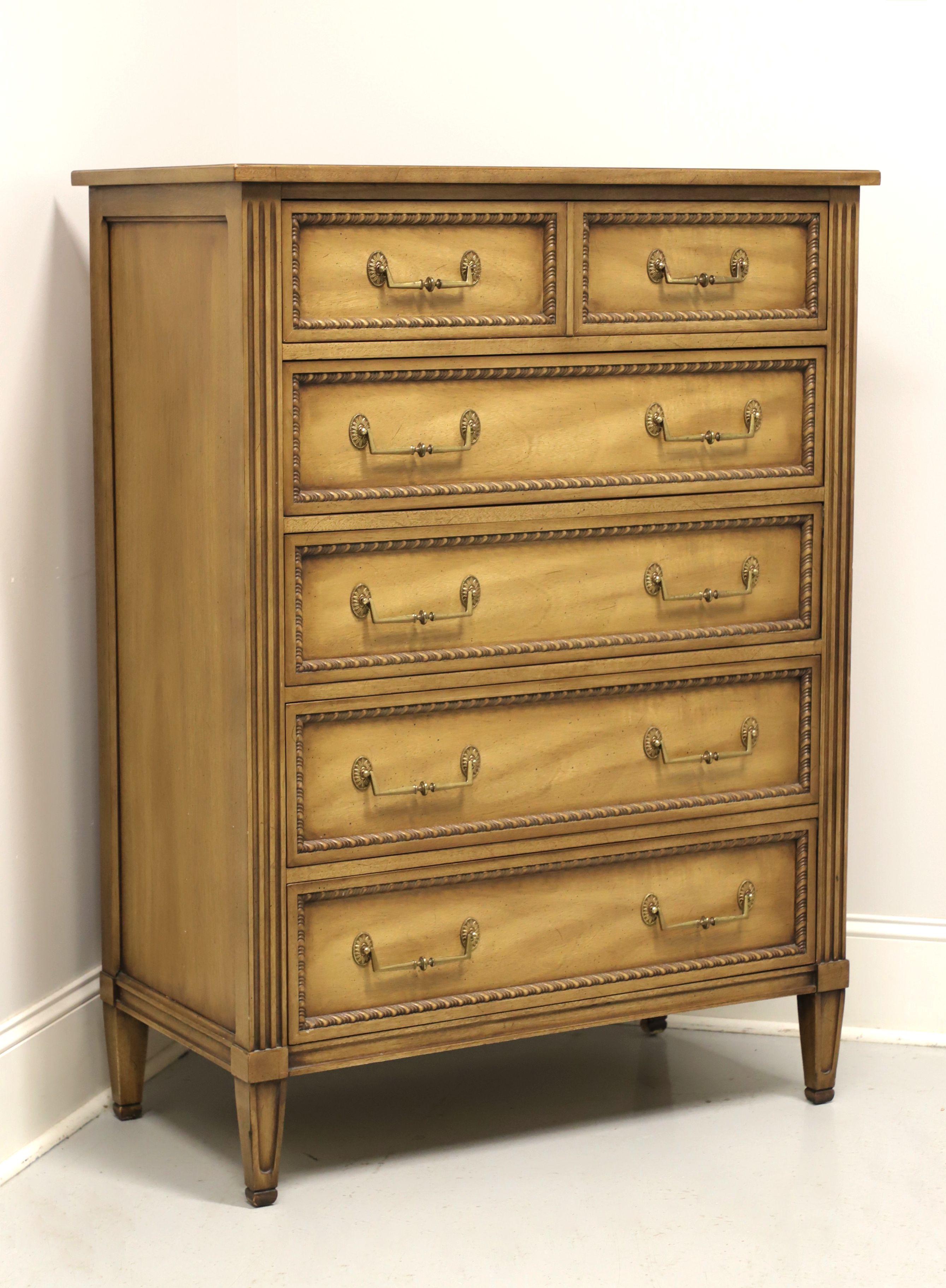 A French Louis XVI style chest of drawers by Henredon. Pecan or similar nutwood, brass hardware, fluted column sides and spade feet. Features five drawers of dovetail construction, top three having removable dividers. Made in Morganton, North