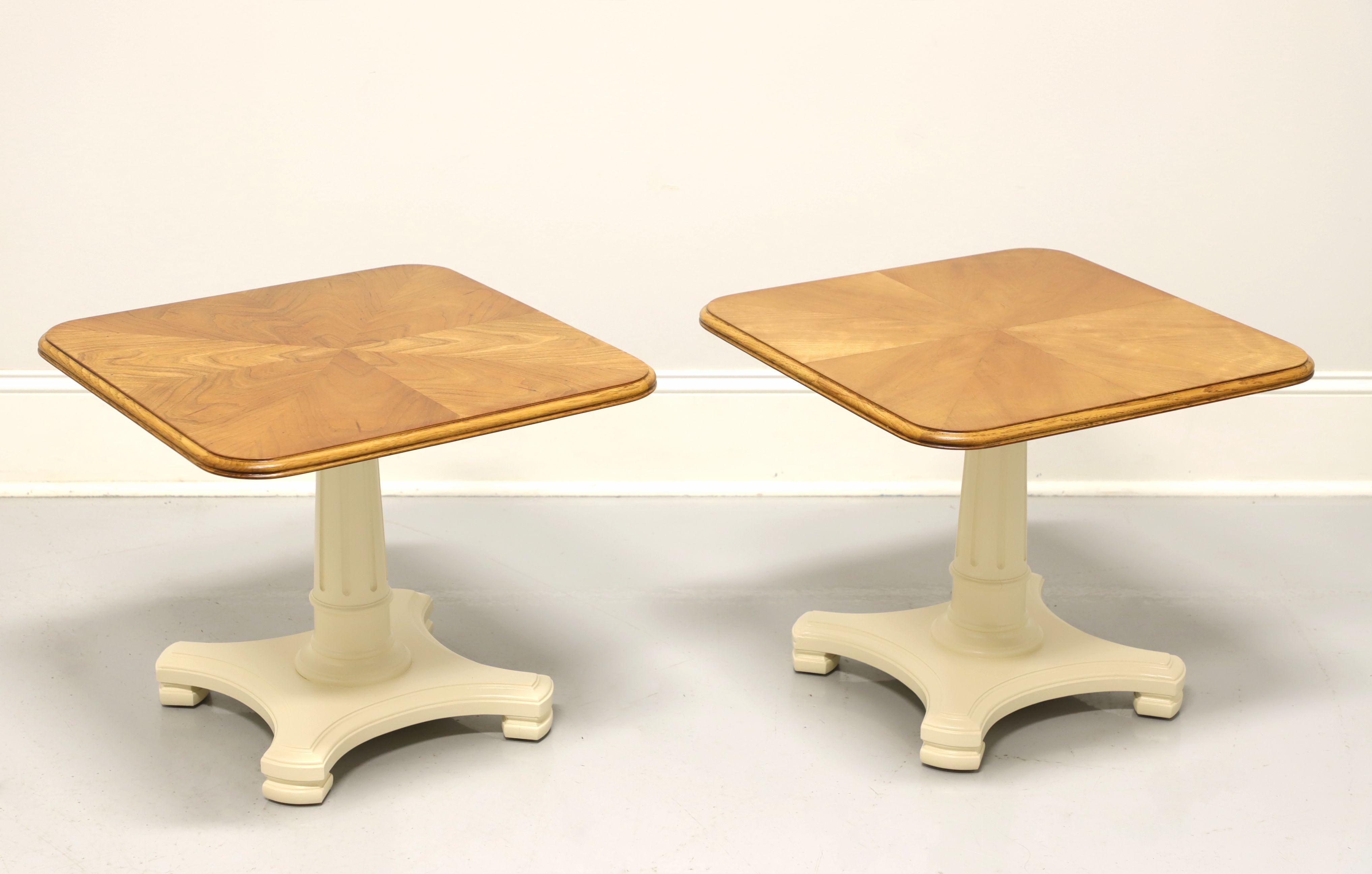 A pair of Neoclassical style square cocktail tables by Henredon. Maple veneer top in a parquetry pattern and freshly painted taupe color pedestal base. Made in the USA, in the mid 20th century.

Measures: 22 W 22 D 18.25 H

Excellent condition with