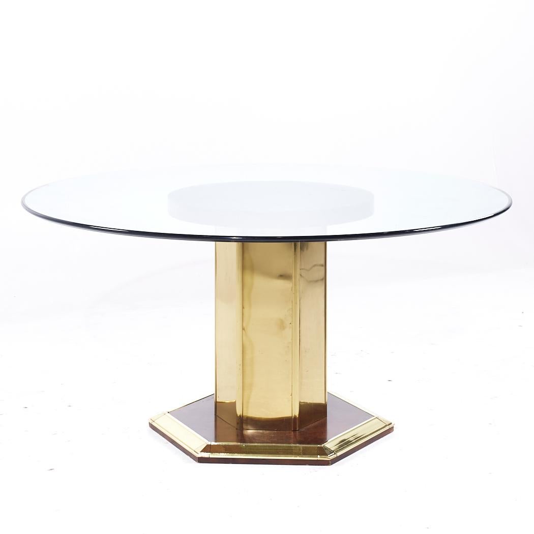 Henredon Mid Century Brass and Glass Pedestal Dining Table

This dining table measures: 60 wide x 60 deep x 29.25 inches high, with a chair clearance of 28.25 inches

All pieces of furniture can be had in what we call restored vintage condition.
