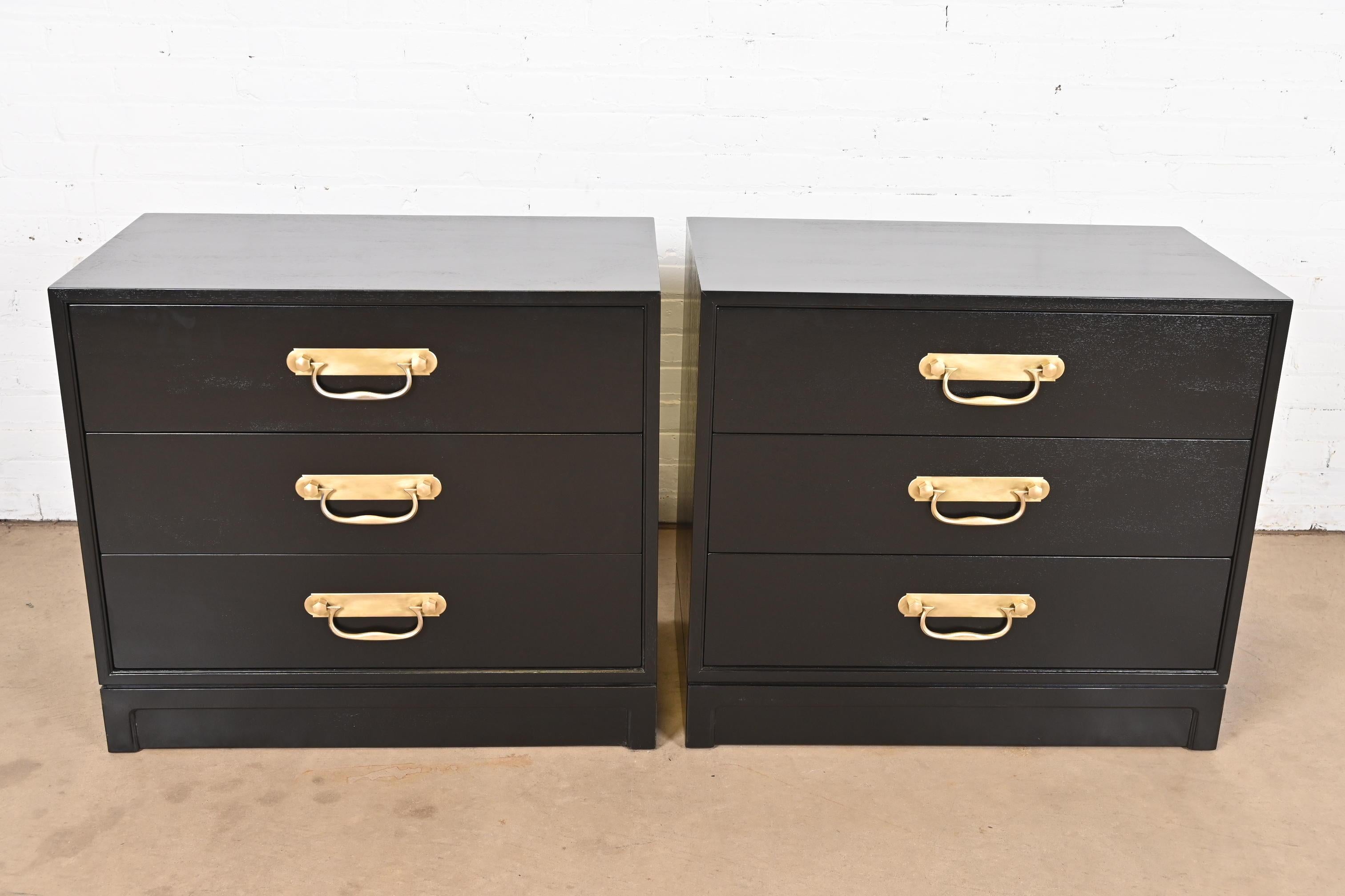 A gorgeous pair of mid-century modern Hollywood Regency three-drawer nightstands or bachelor chests

By Henredon

USA, Circa 1960s

Black lacquered walnut, with original brass hardware.

Measures: 32