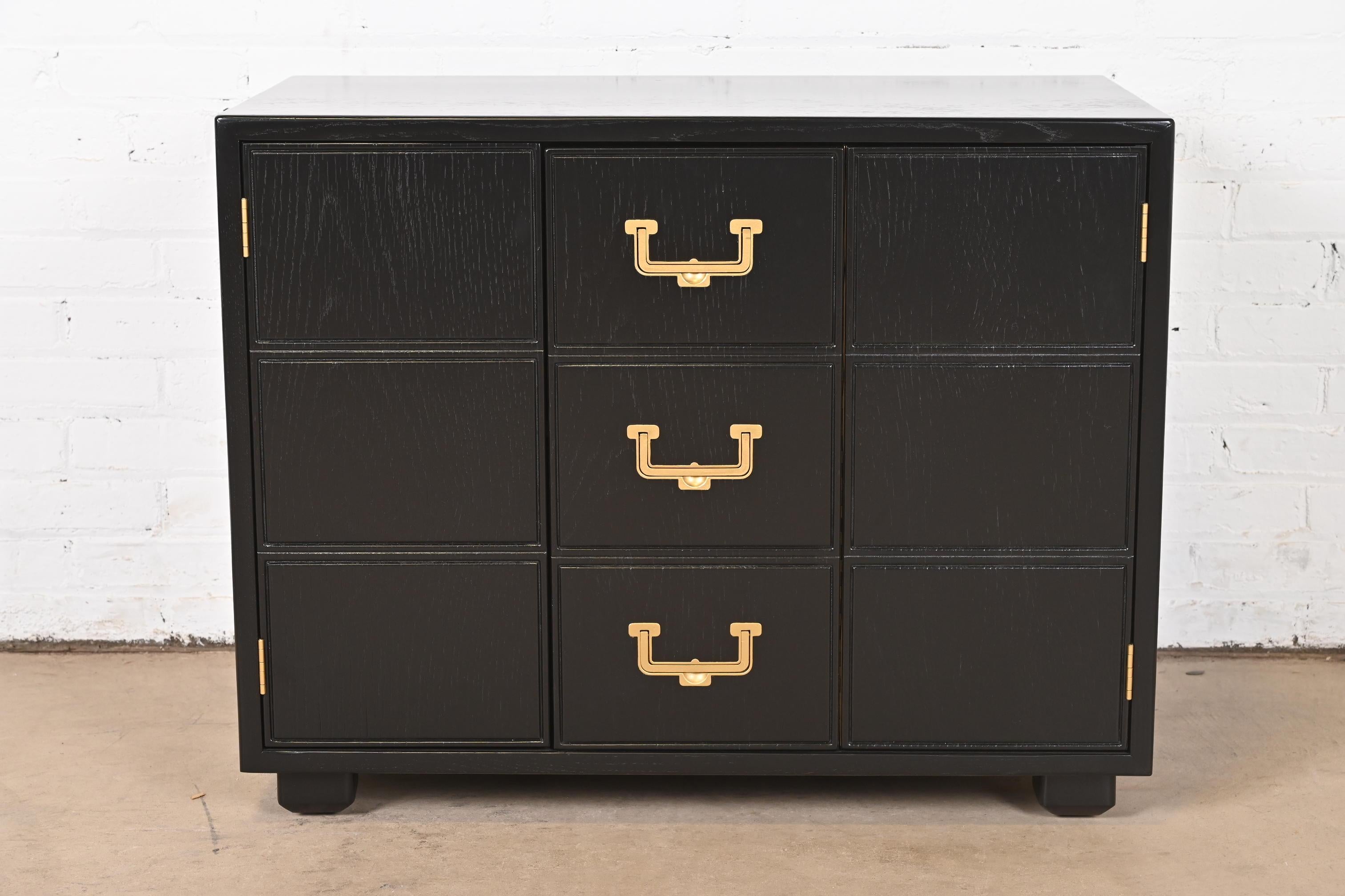 A gorgeous mid-century modern Hollywood Regency Campaign style chest or cabinet

By Henredon, 