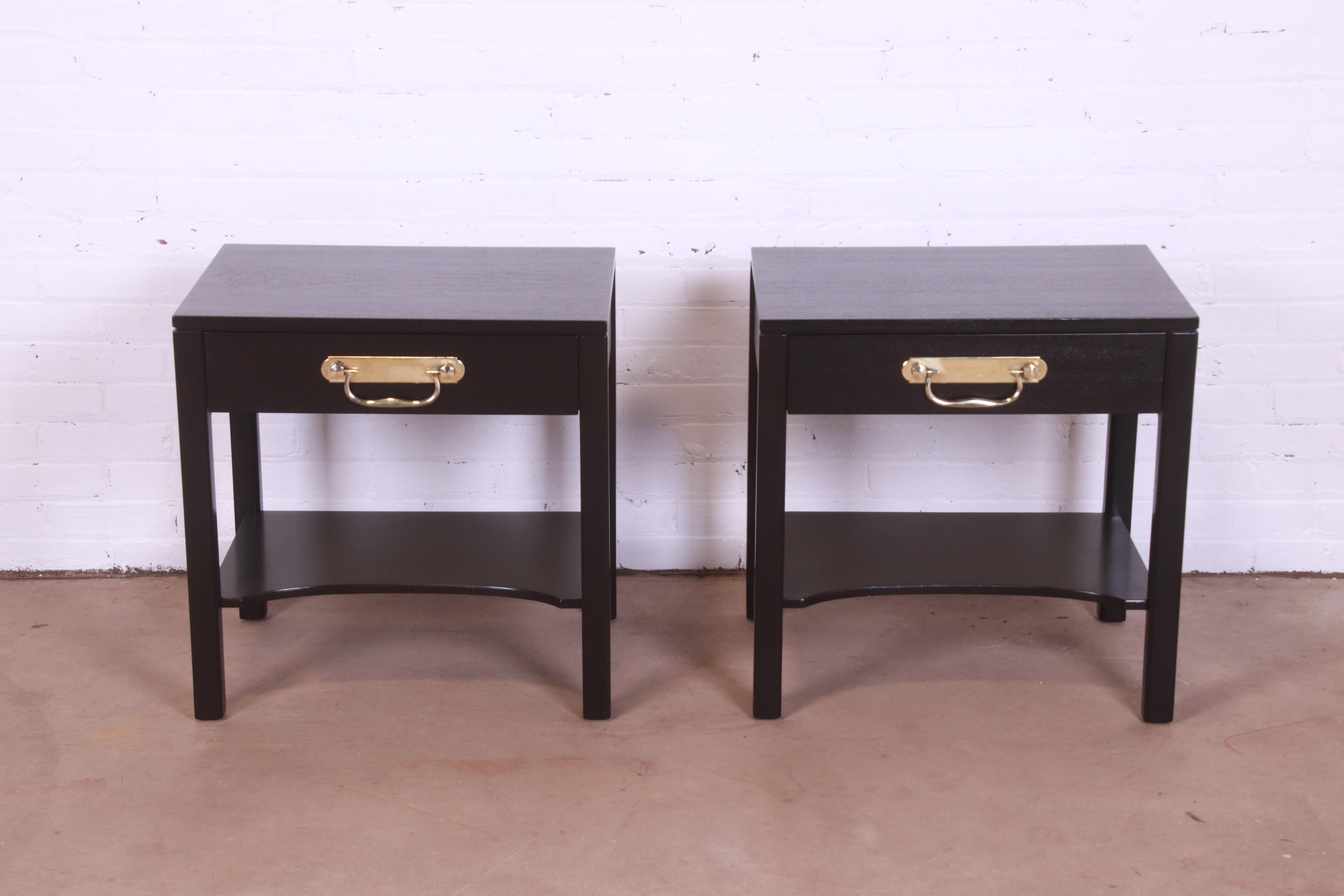 A gorgeous pair of mid-century modern Hollywood Regency nightstands

By Henredon

USA, Circa 1960s

Black lacquered mahogany, with original brass hardware.

Measures: 24