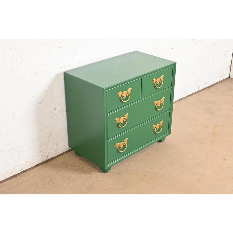 An exceptional Mid-Century Modern Hollywood Regency Chinoiserie four-drawer nightstand or chest of drawers

By Henredon

USA, Circa 1970s

Green lacquered walnut, with original Asian-inspired brass hardware.

Measures: 28.13