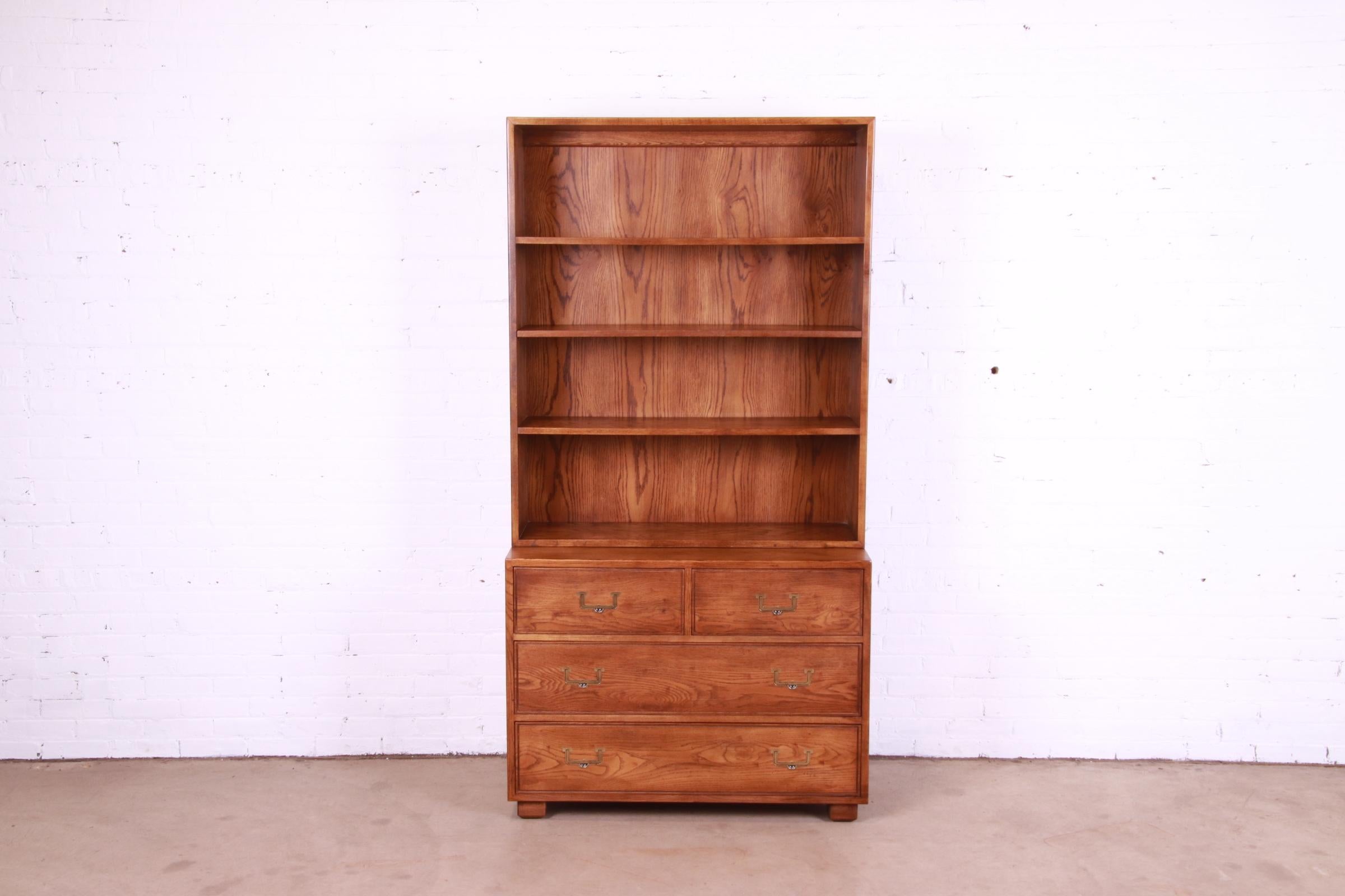 A gorgeous Mid-Century Modern Campaign style chest of drawers with bookcase top

By Henredon, 