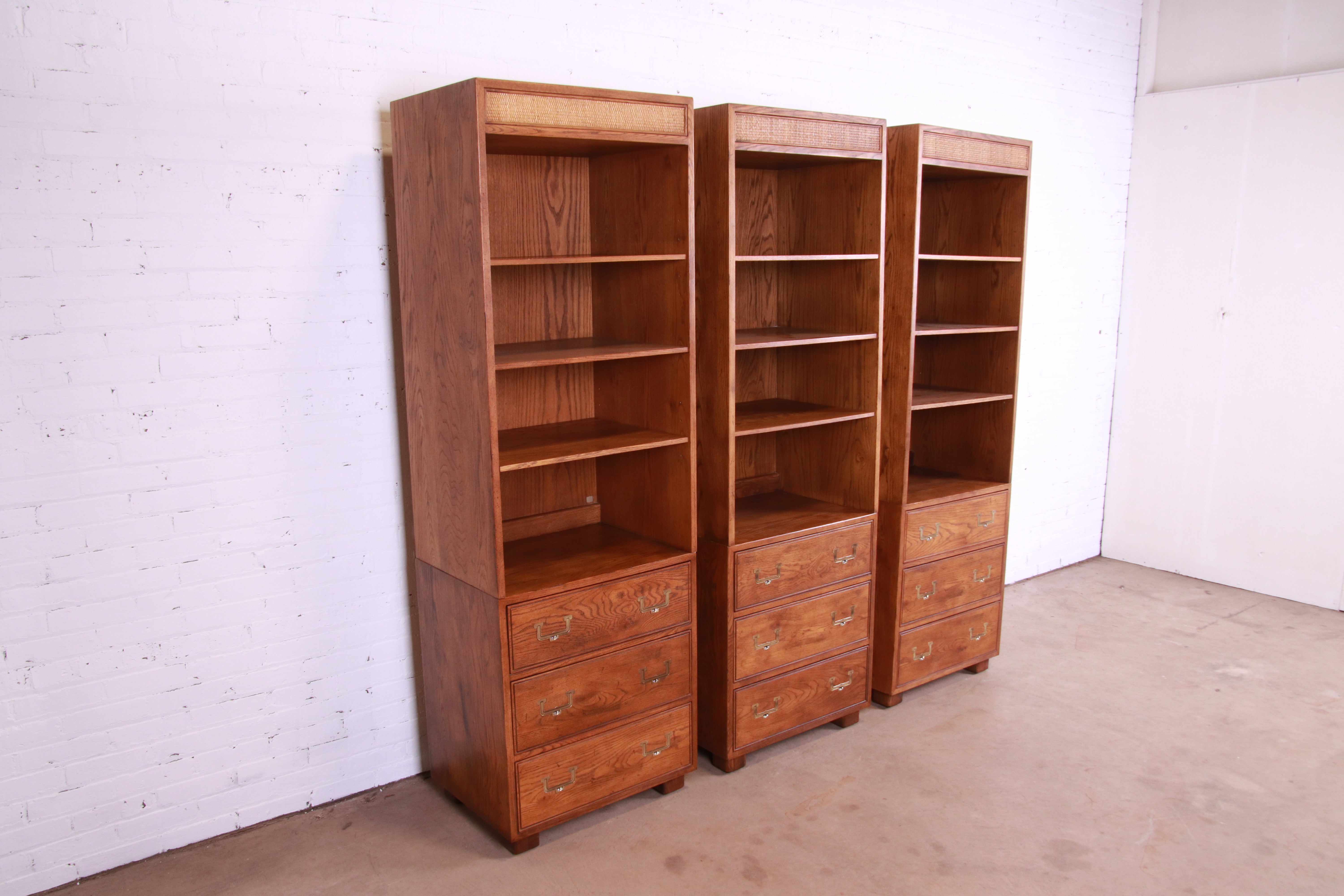 A gorgeous set of three mid-century modern Campaign bookcases on chests

By Henredon, 
