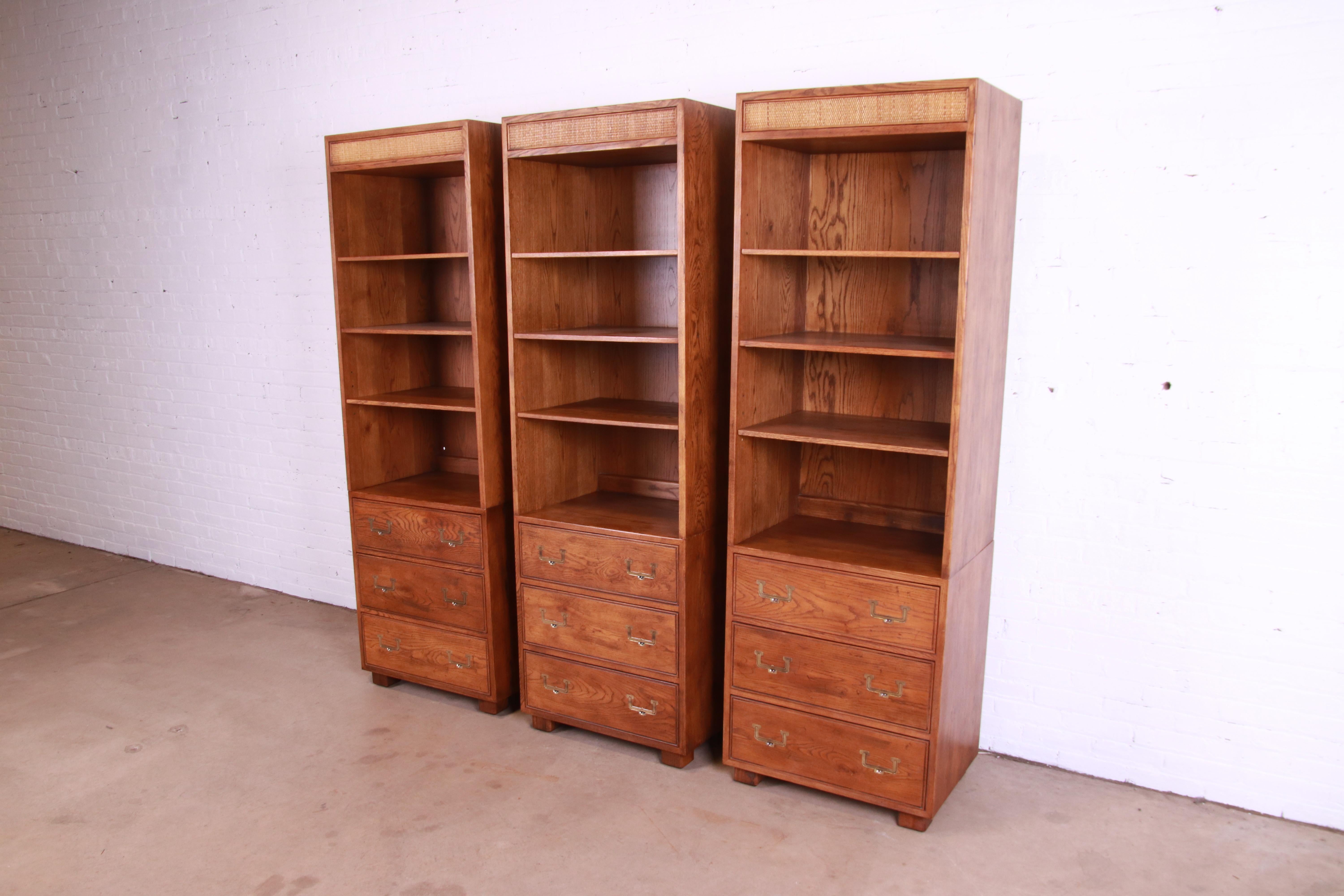 American Henredon Mid-Century Modern Campaign Oak and Cane Bookcases on Chests, Set of 3