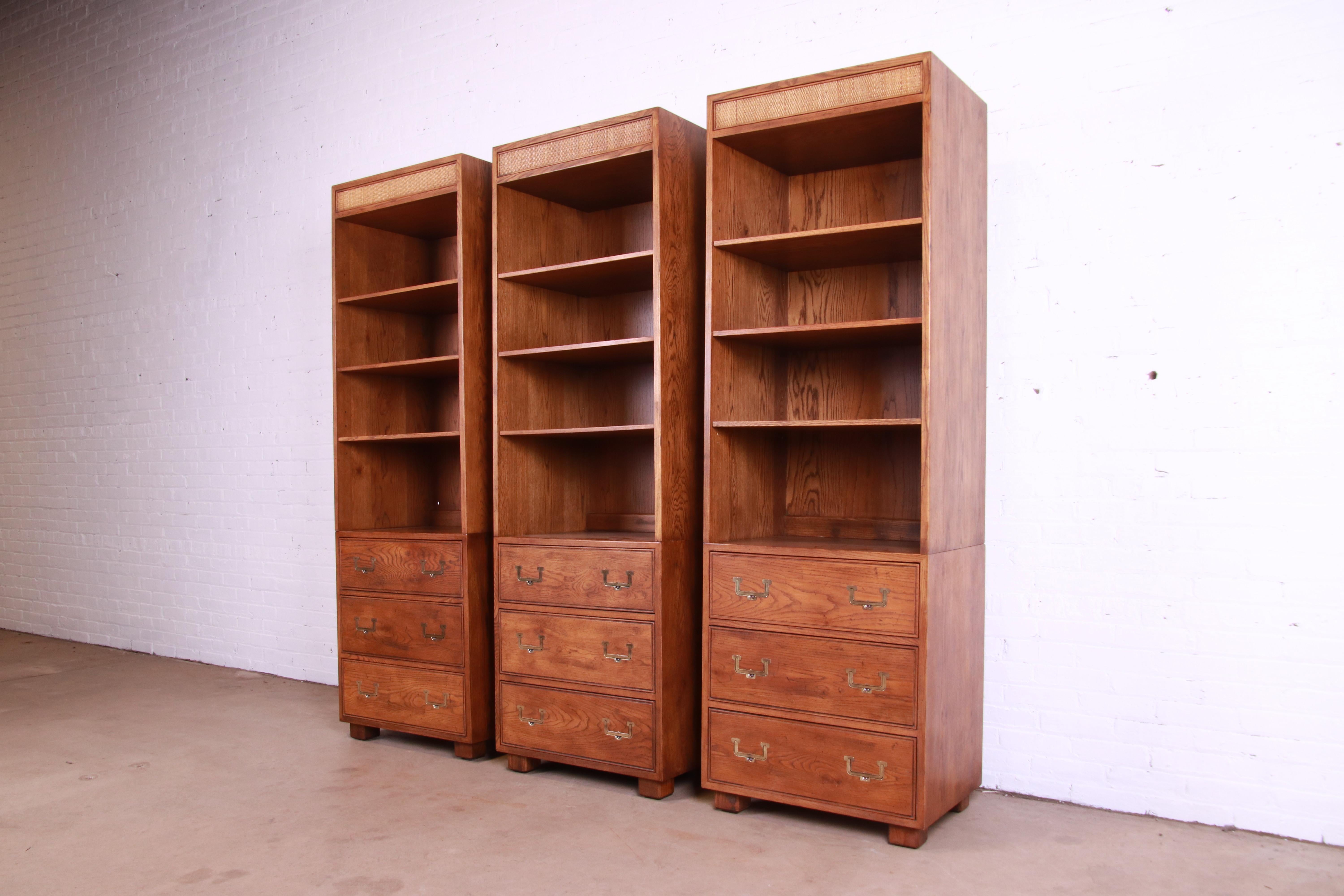 Henredon Mid-Century Modern Campaign Oak and Cane Bookcases on Chests, Set of 3 In Good Condition In South Bend, IN